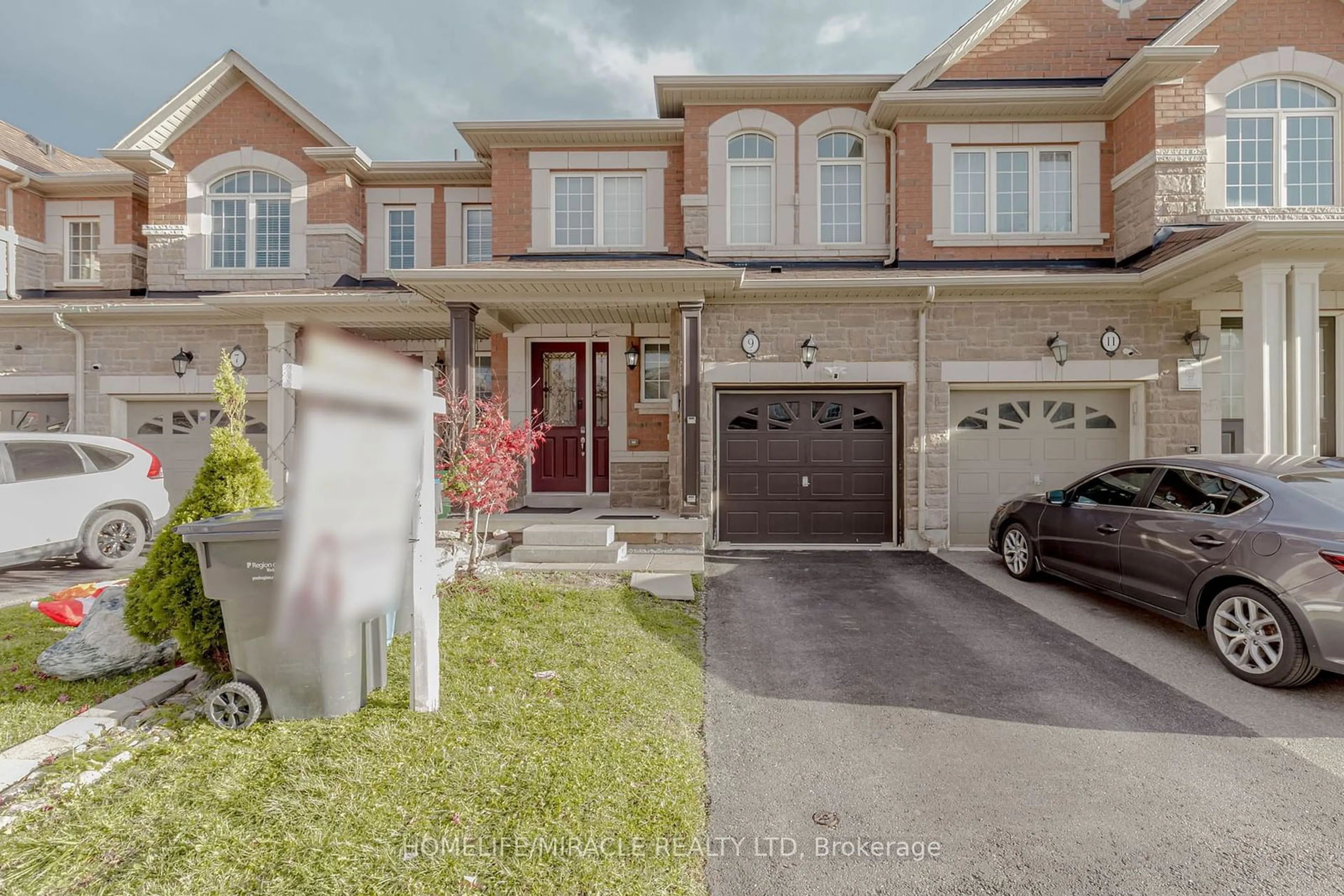 A pic from exterior of the house or condo, the street view for 9 Dufay Rd, Brampton Ontario L7A 4A1