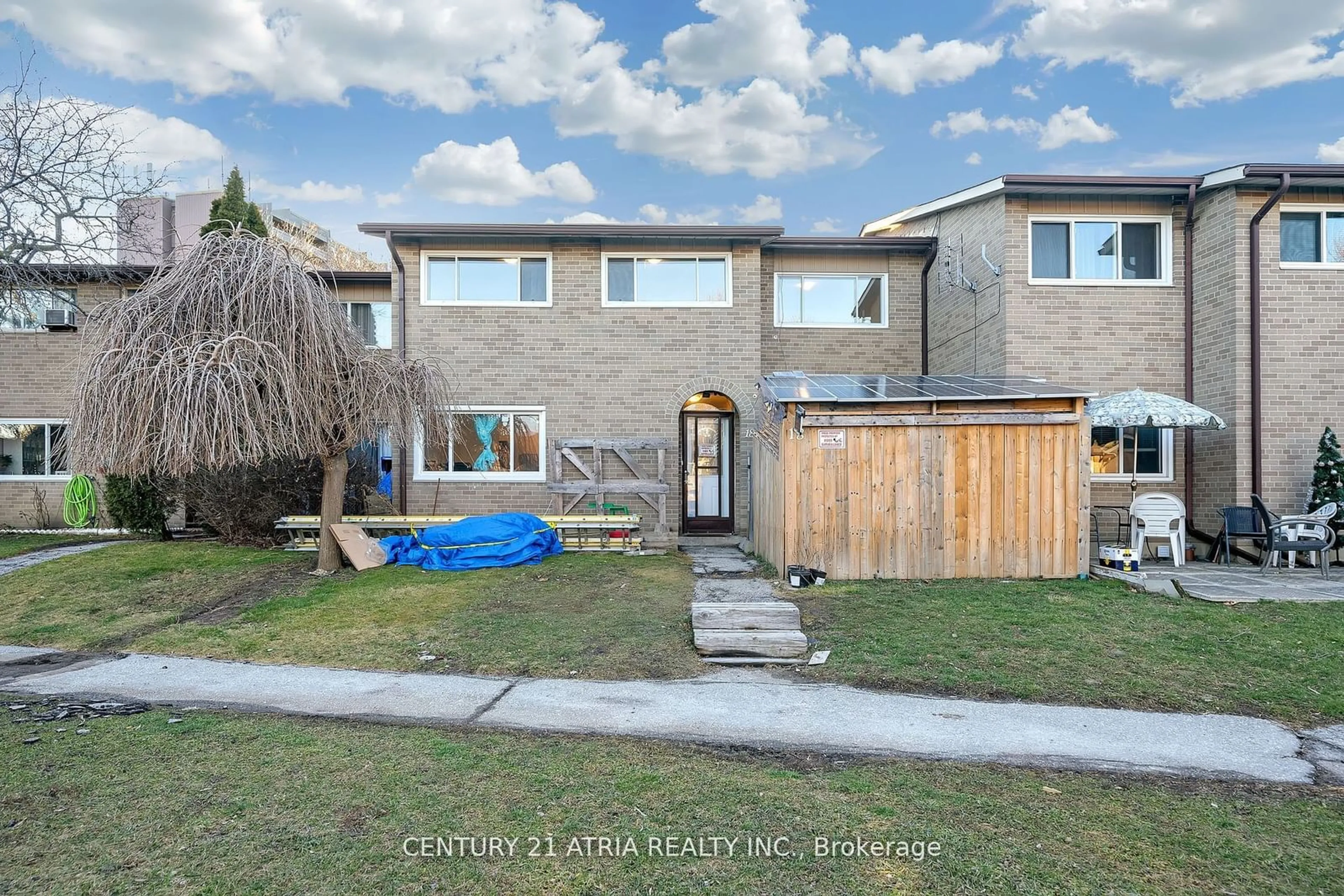 Frontside or backside of a home, the fenced backyard for 73 Driftwood Ave #18, Toronto Ontario M3N 2M7