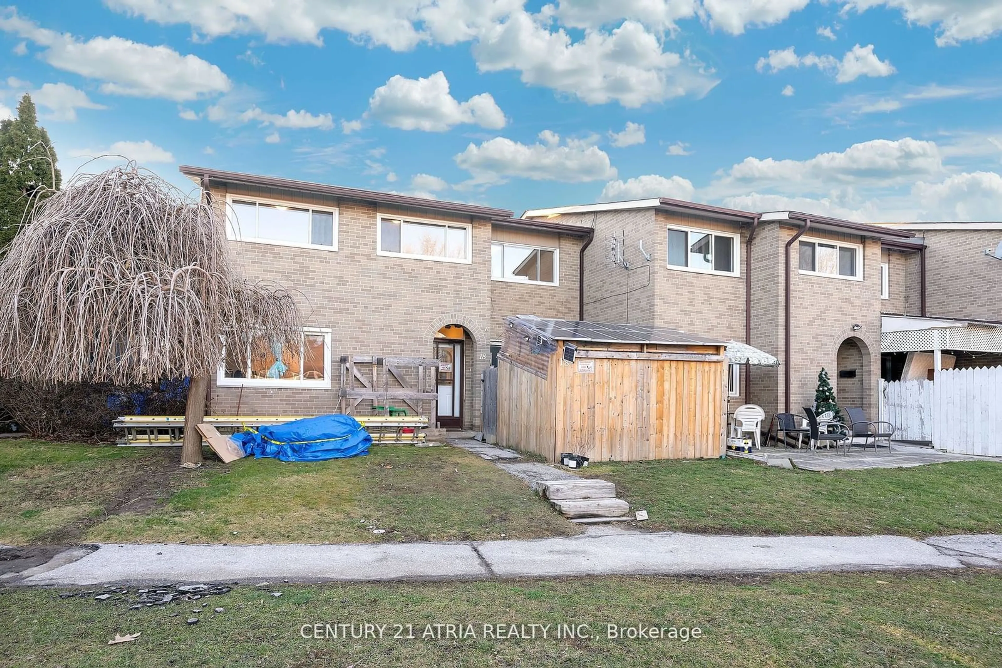 Frontside or backside of a home, the fenced backyard for 73 Driftwood Ave #18, Toronto Ontario M3N 2M7