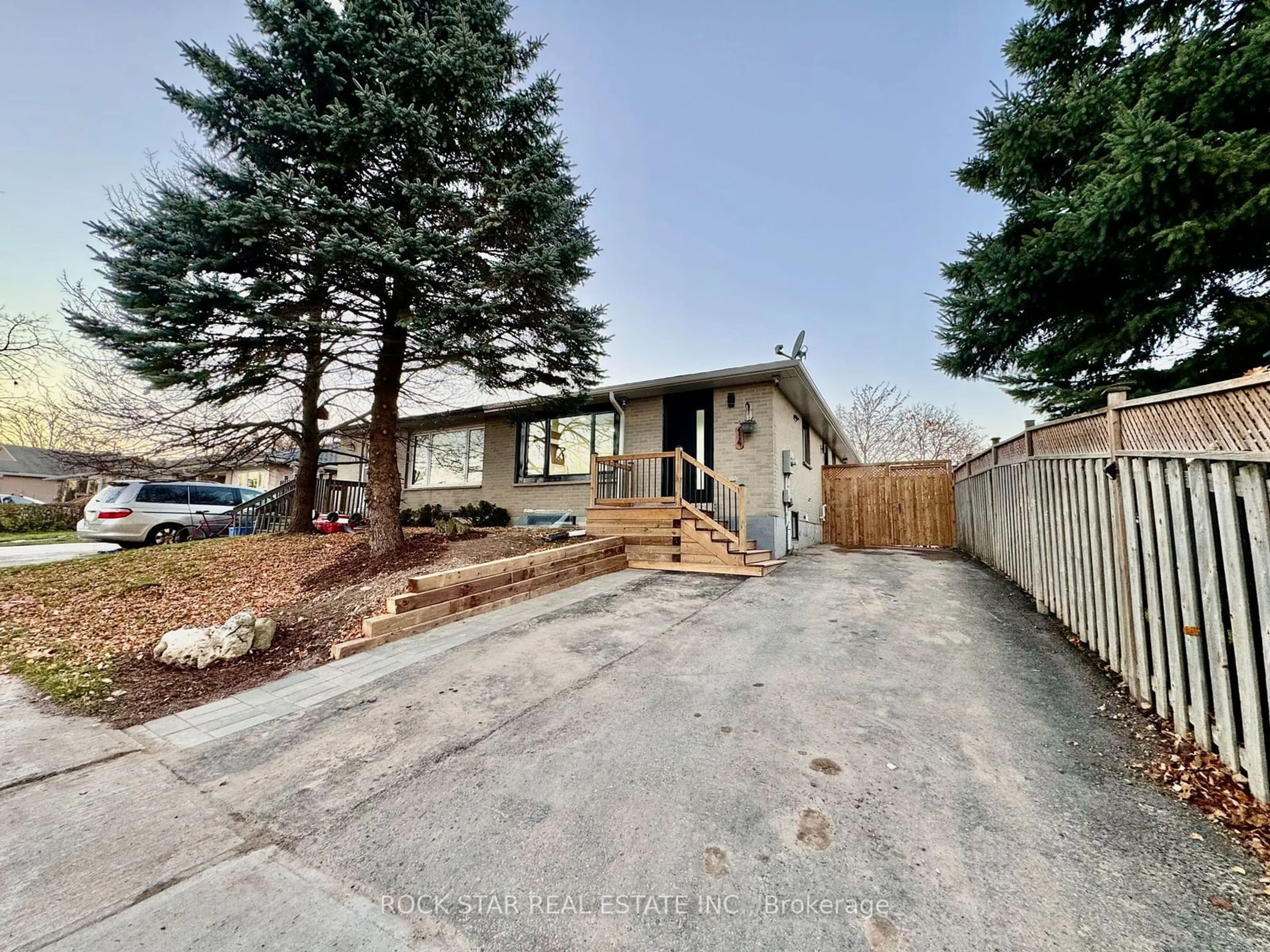 Frontside or backside of a home, the fenced backyard for 14 Feltre Ave, Orangeville Ontario L9W 3P1