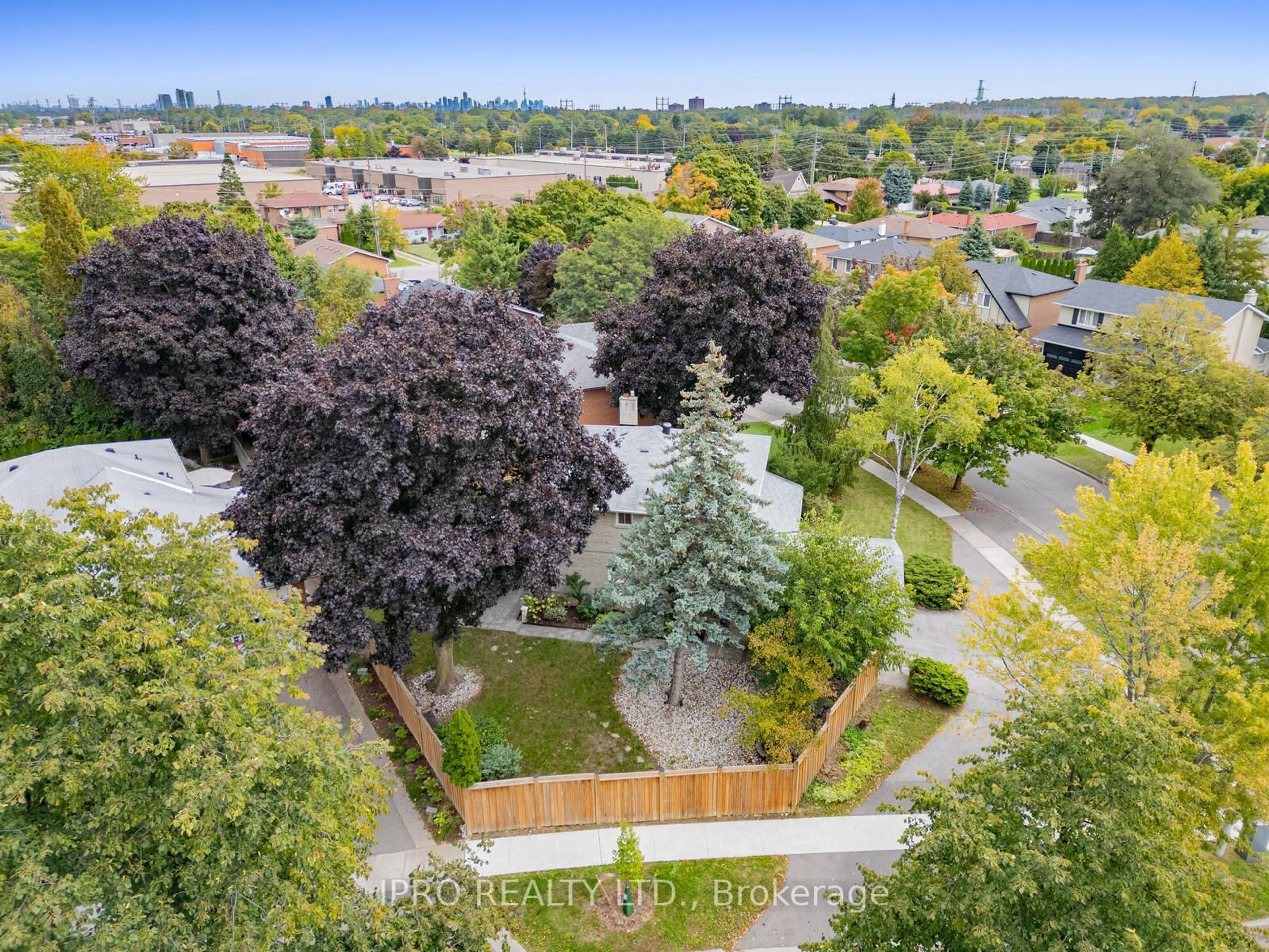 A pic from exterior of the house or condo, the fenced backyard for 447 Edgeworth Rd, Mississauga Ontario L5A 1R6