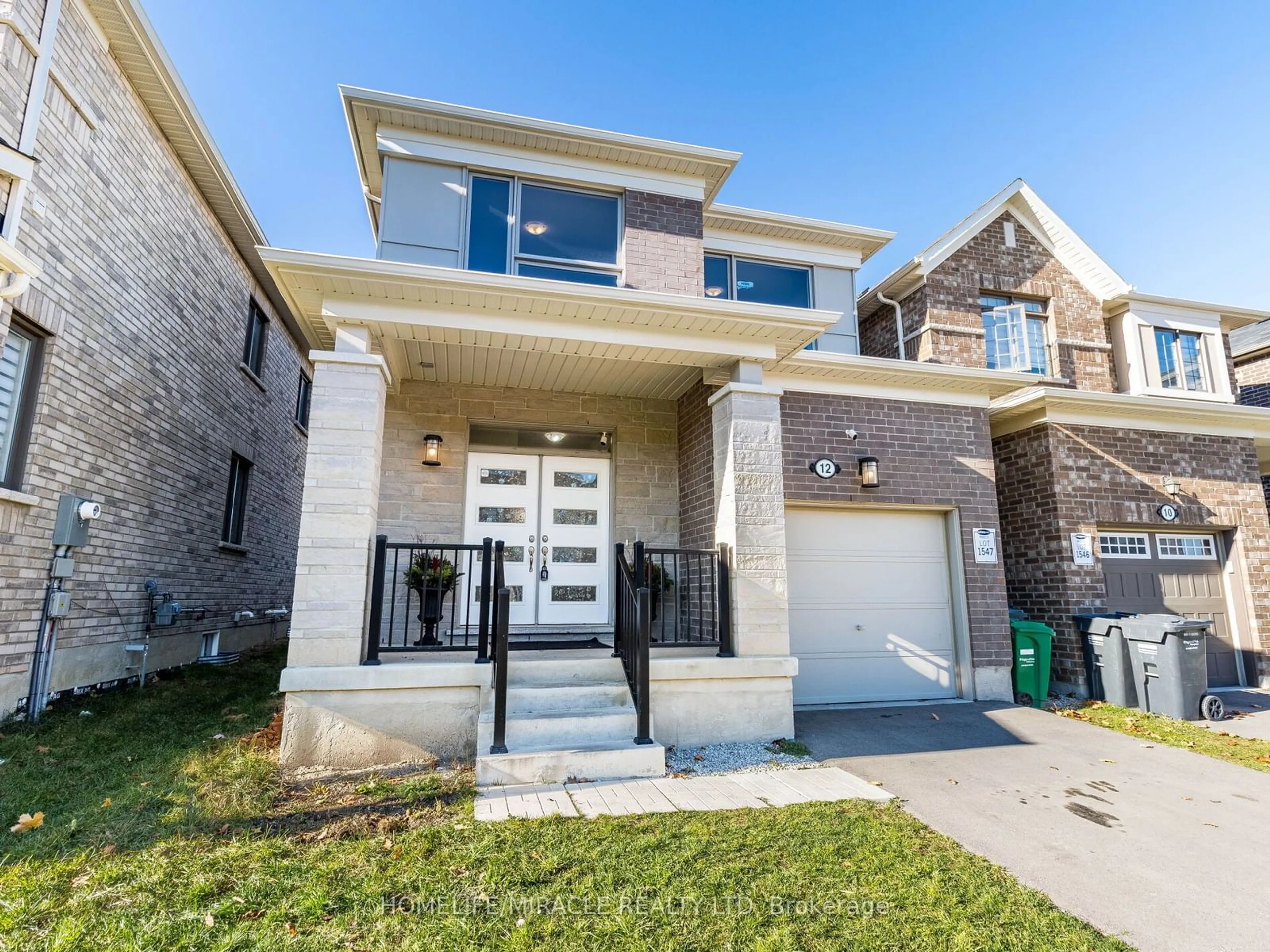 Home with brick exterior material for 12 Callahan Crt, Brampton Ontario L7A 5H3