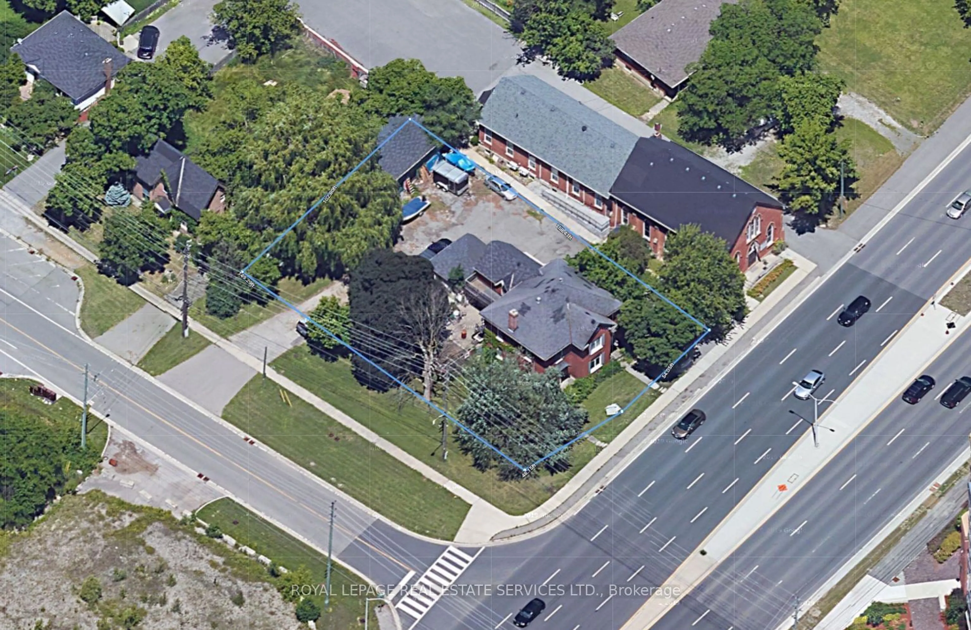 Frontside or backside of a home, the street view for 2527 Dundas St, Oakville Ontario L6M 4J4