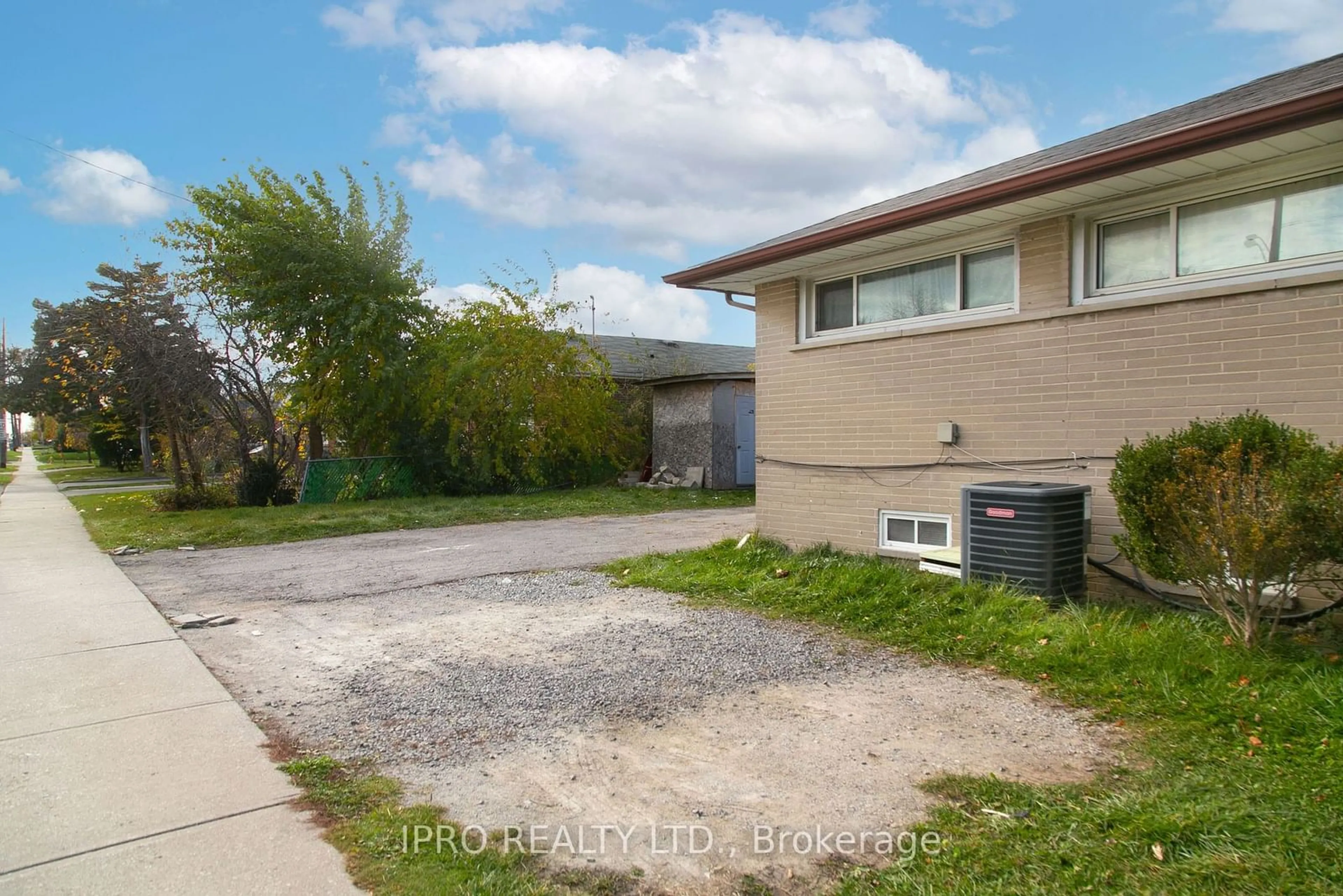 Frontside or backside of a home, the fenced backyard for 2476 Islington Ave, Toronto Ontario M9W 3Y1