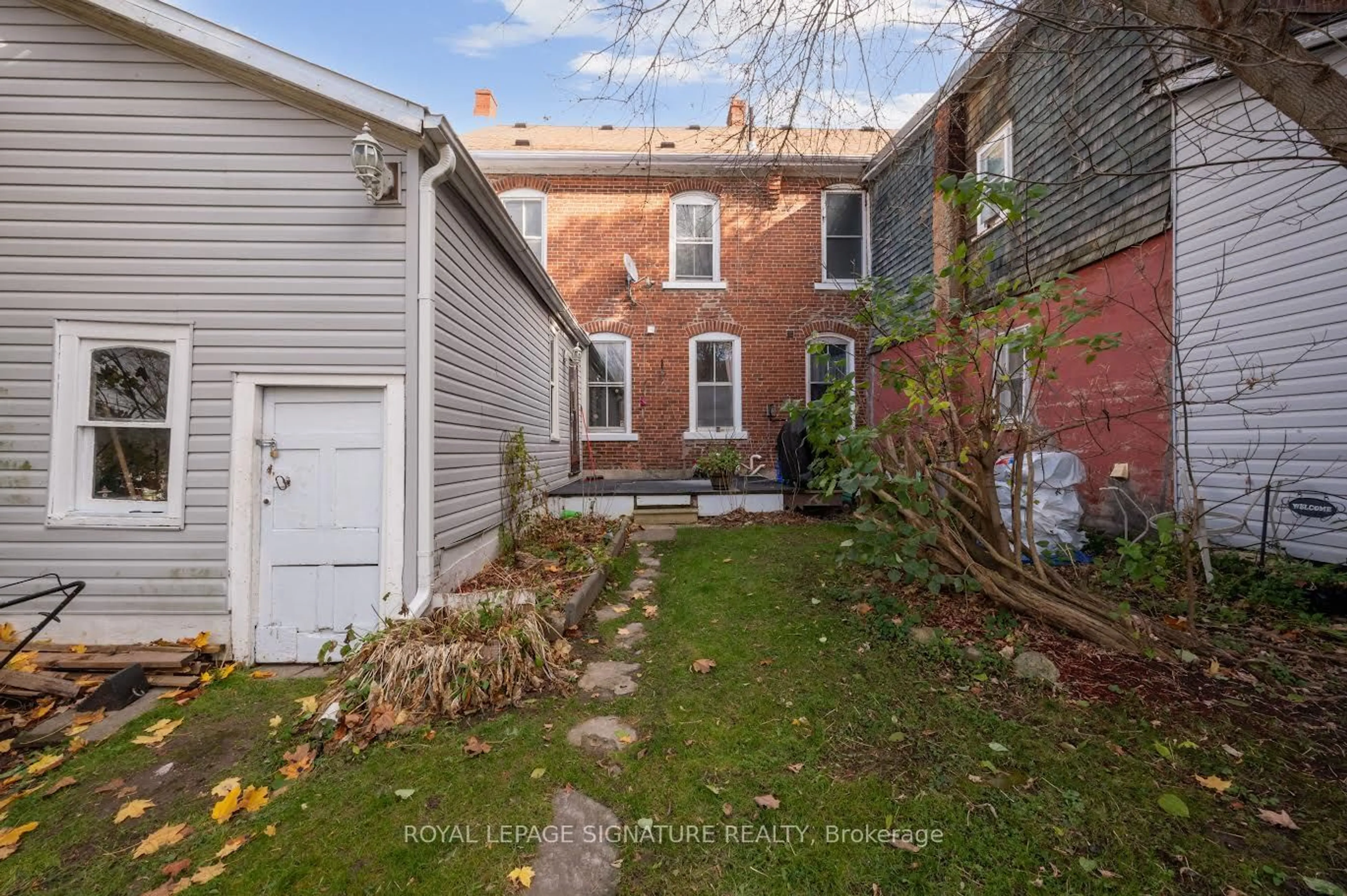 A pic from exterior of the house or condo, the fenced backyard for 18 First St, Orangeville Ontario L9W 2C7