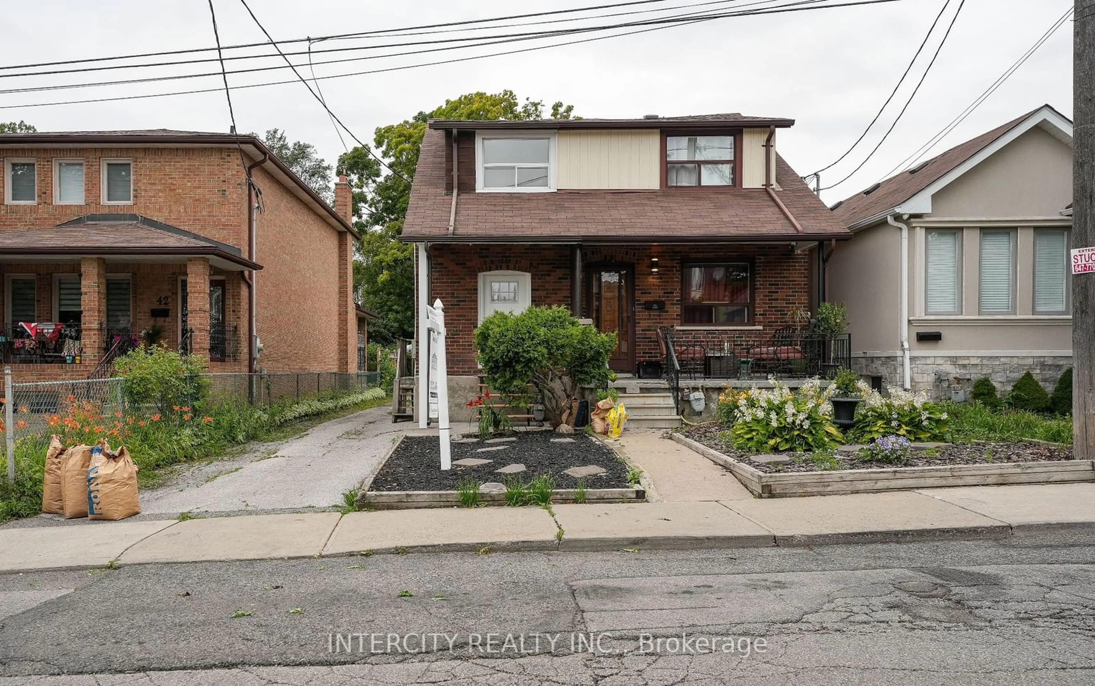 Frontside or backside of a home, the street view for 44 Branstone Rd, Toronto Ontario M6E 4E4