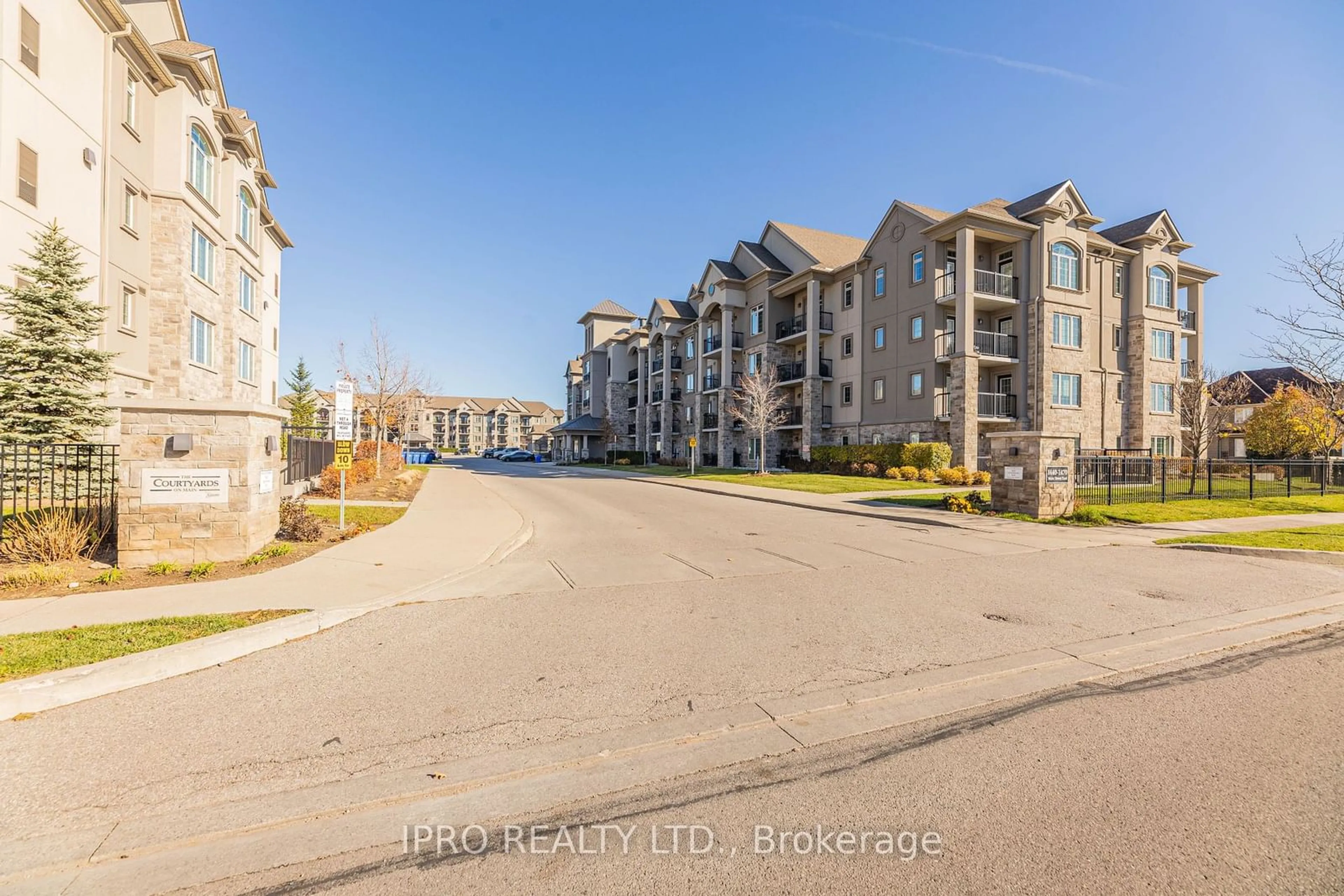 A pic from exterior of the house or condo, the street view for 1450 Main St #304, Milton Ontario L9T 8W4