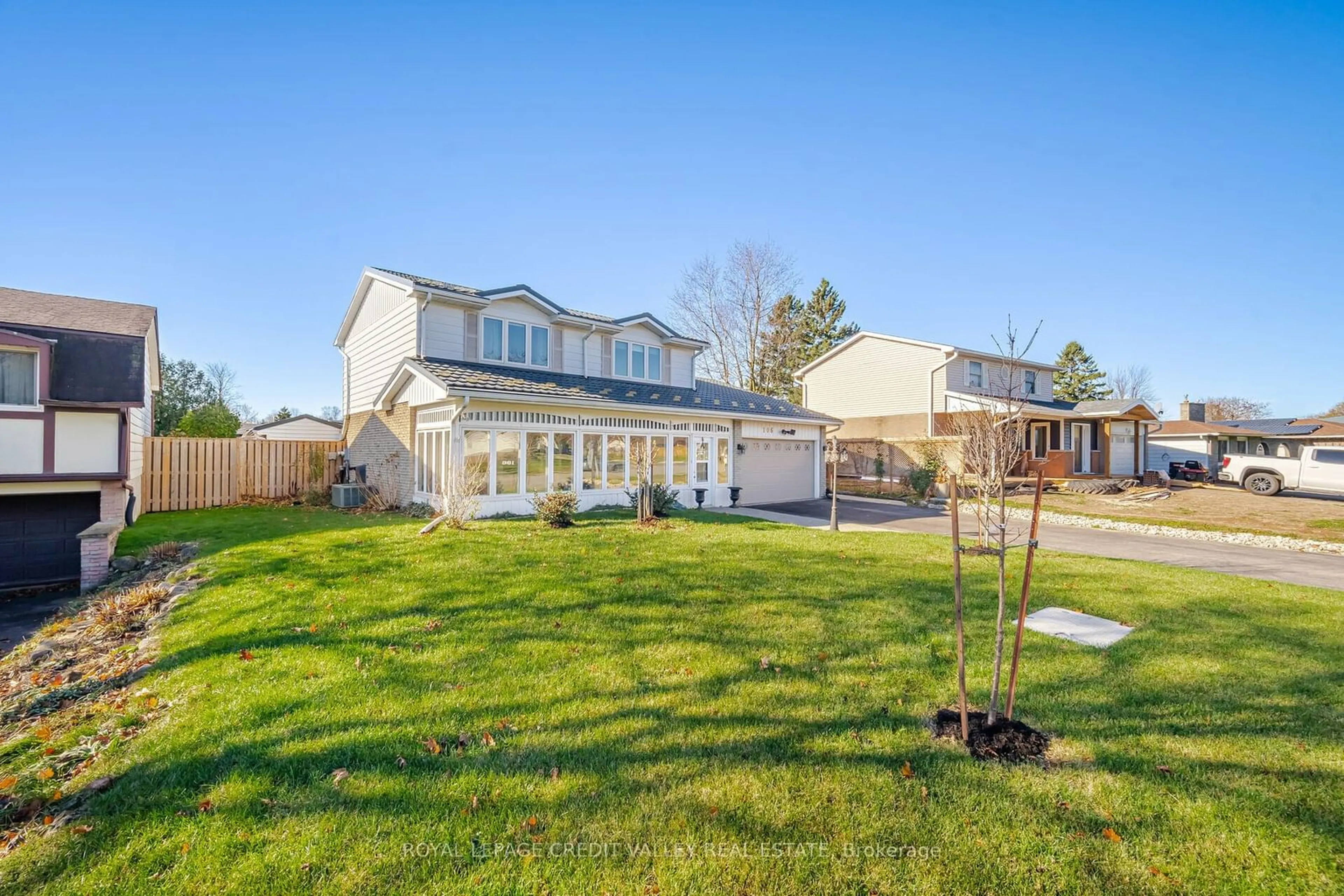 A pic from exterior of the house or condo, the fenced backyard for 106 Acton Blvd, Halton Hills Ontario L7J 2H7