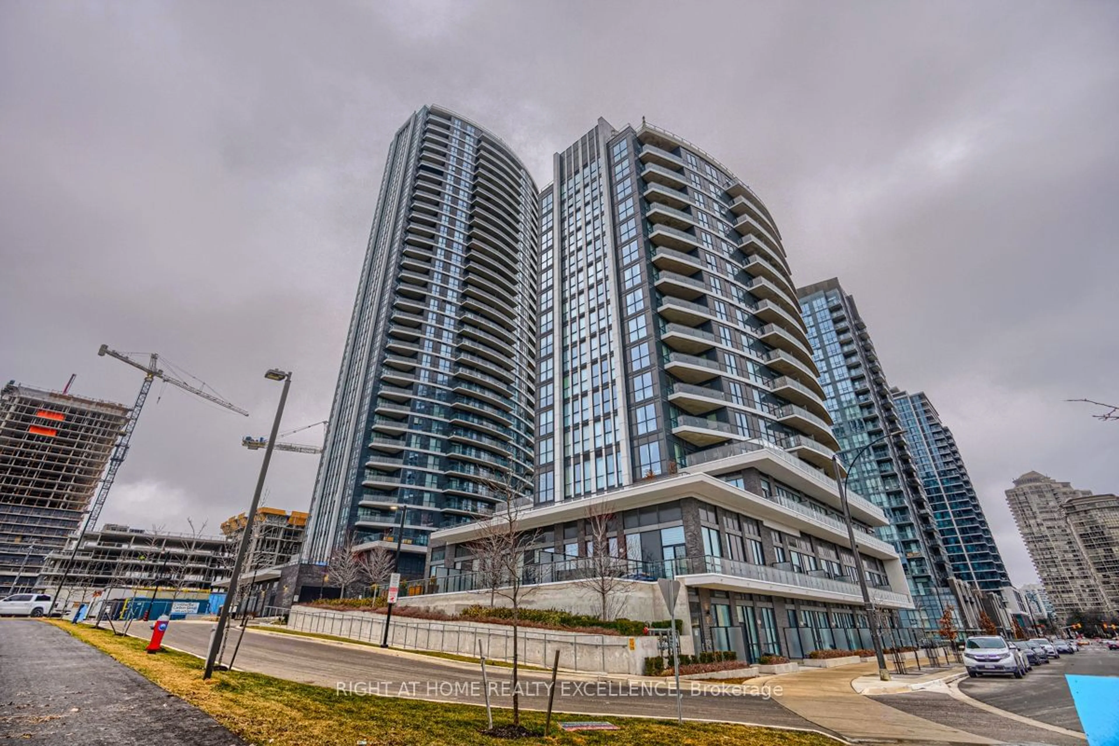 A pic from exterior of the house or condo, the view of city buildings for 65 Watergarden Dr #201, Mississauga Ontario L5R 0G9