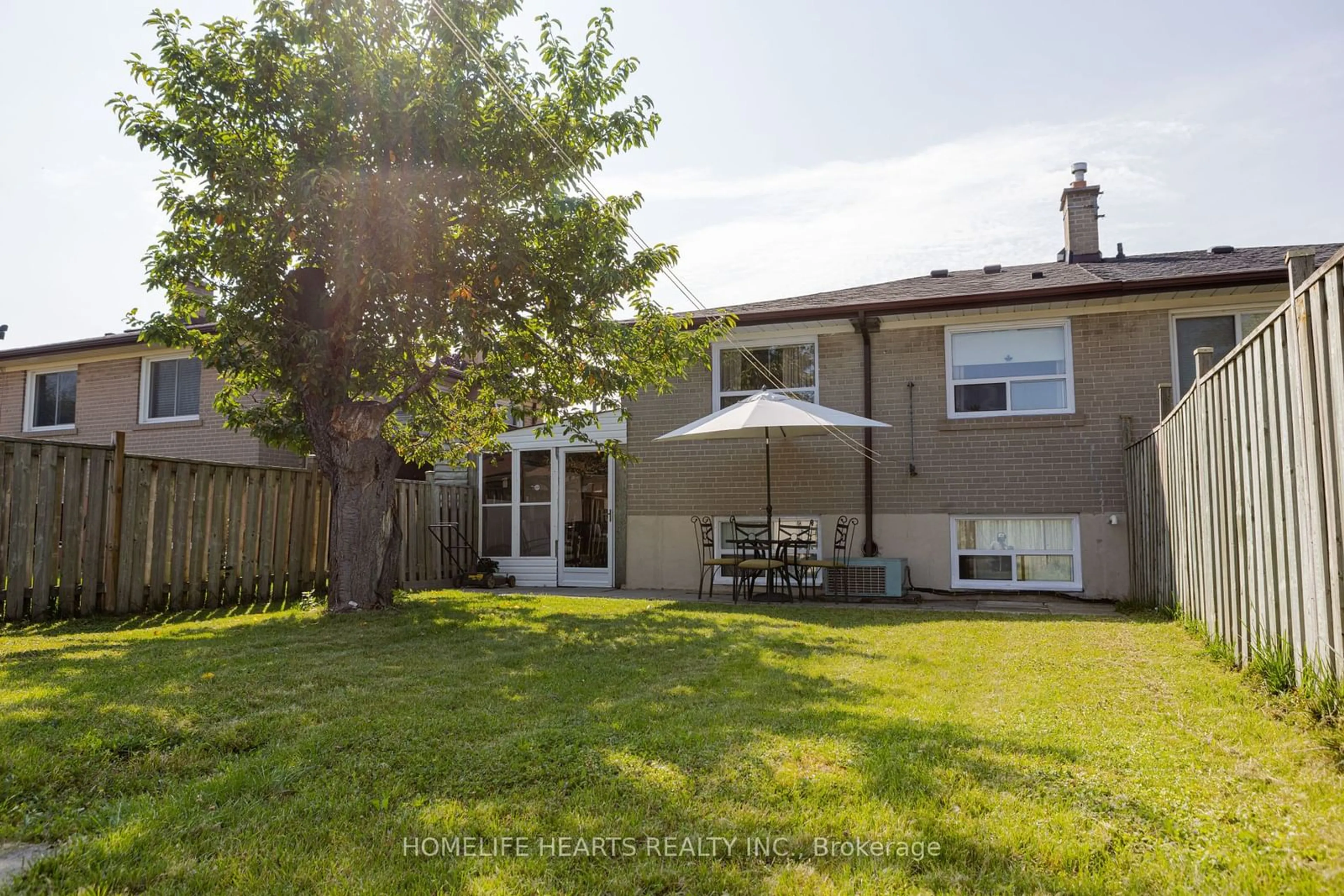 Frontside or backside of a home, the fenced backyard for 58 Frankton Cres, Toronto Ontario M3J 1C1