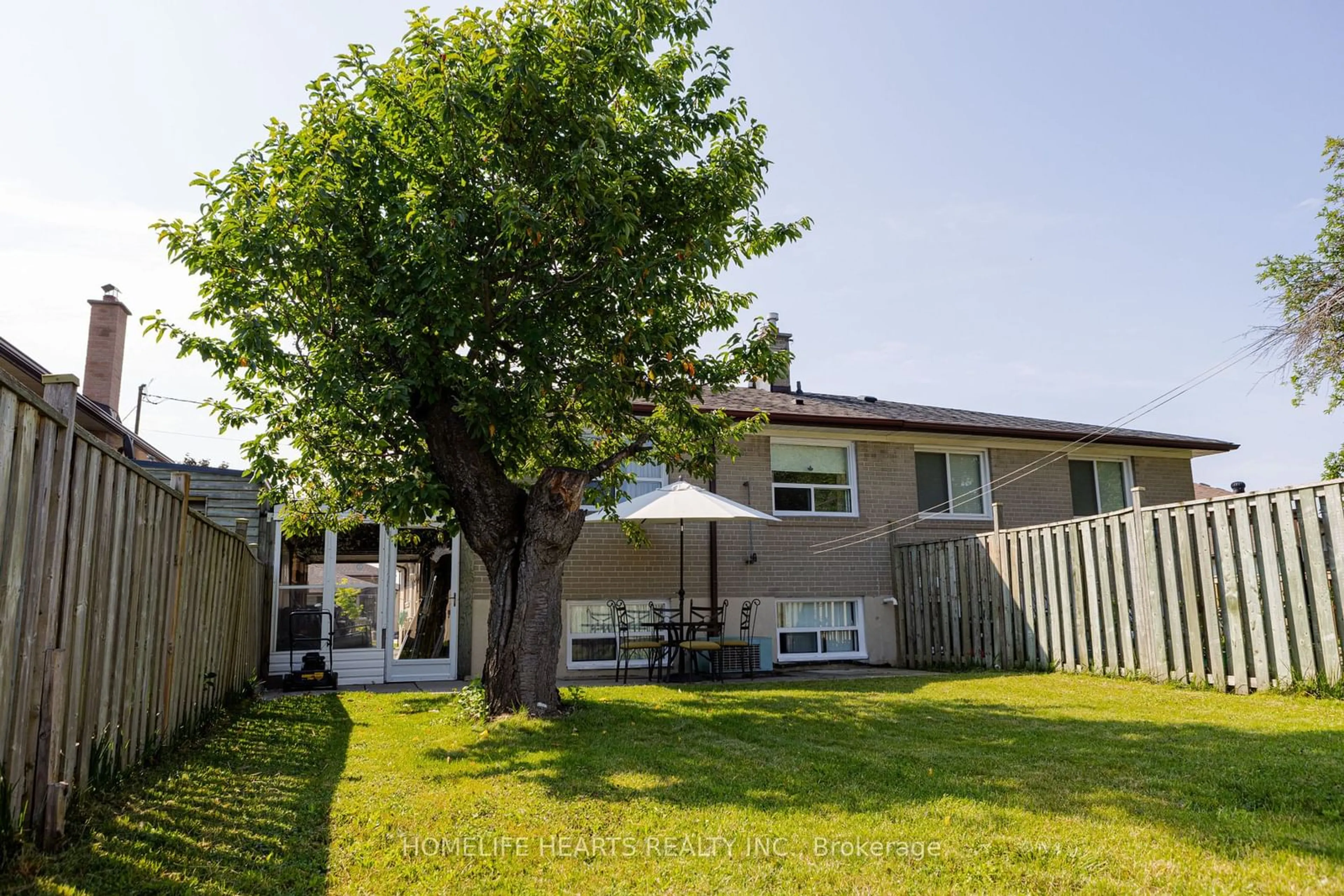 Frontside or backside of a home, the fenced backyard for 58 Frankton Cres, Toronto Ontario M3J 1C1