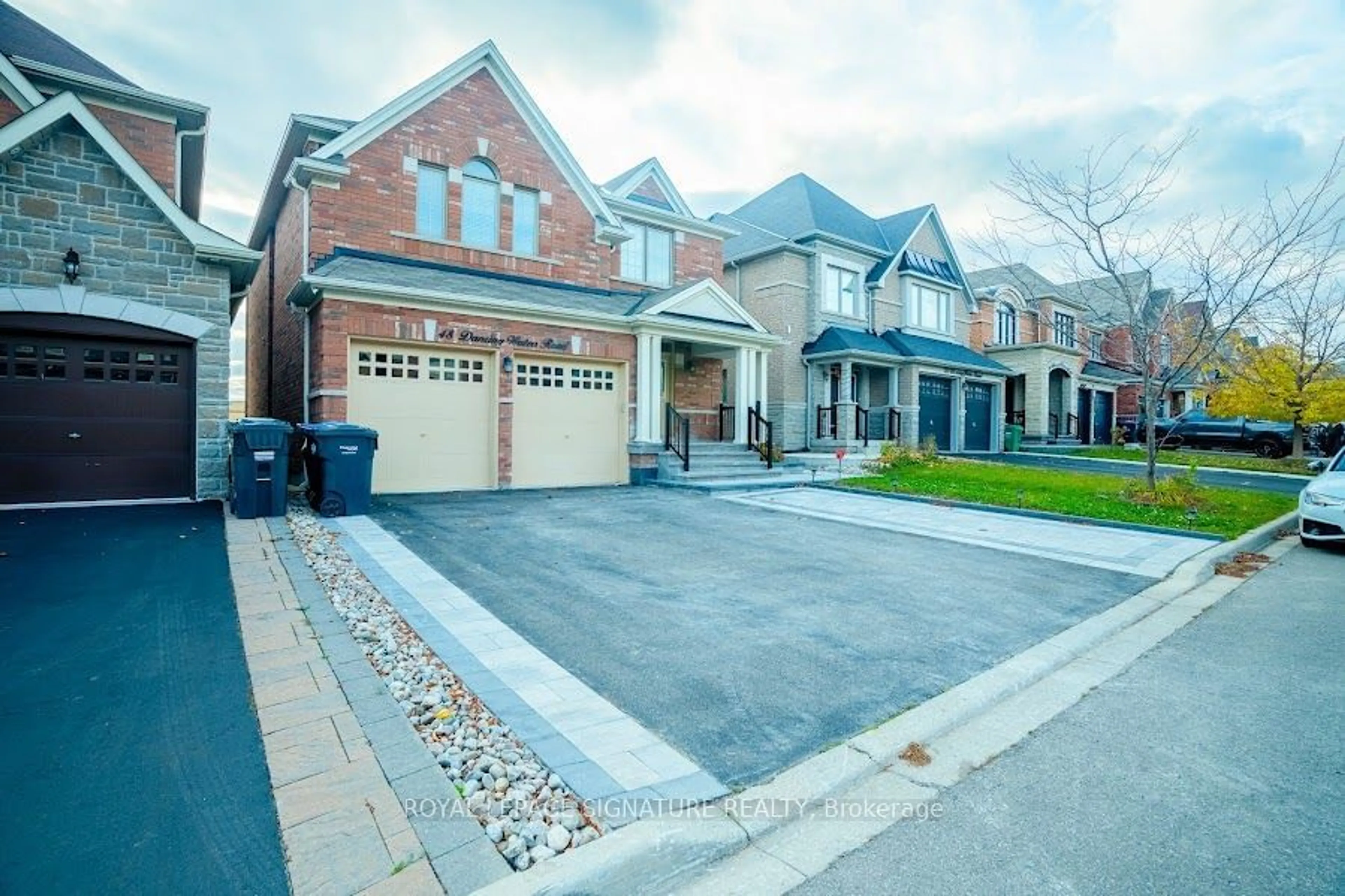 Home with brick exterior material for 48 Dancing Waters Rd, Brampton Ontario L6Y 0L3