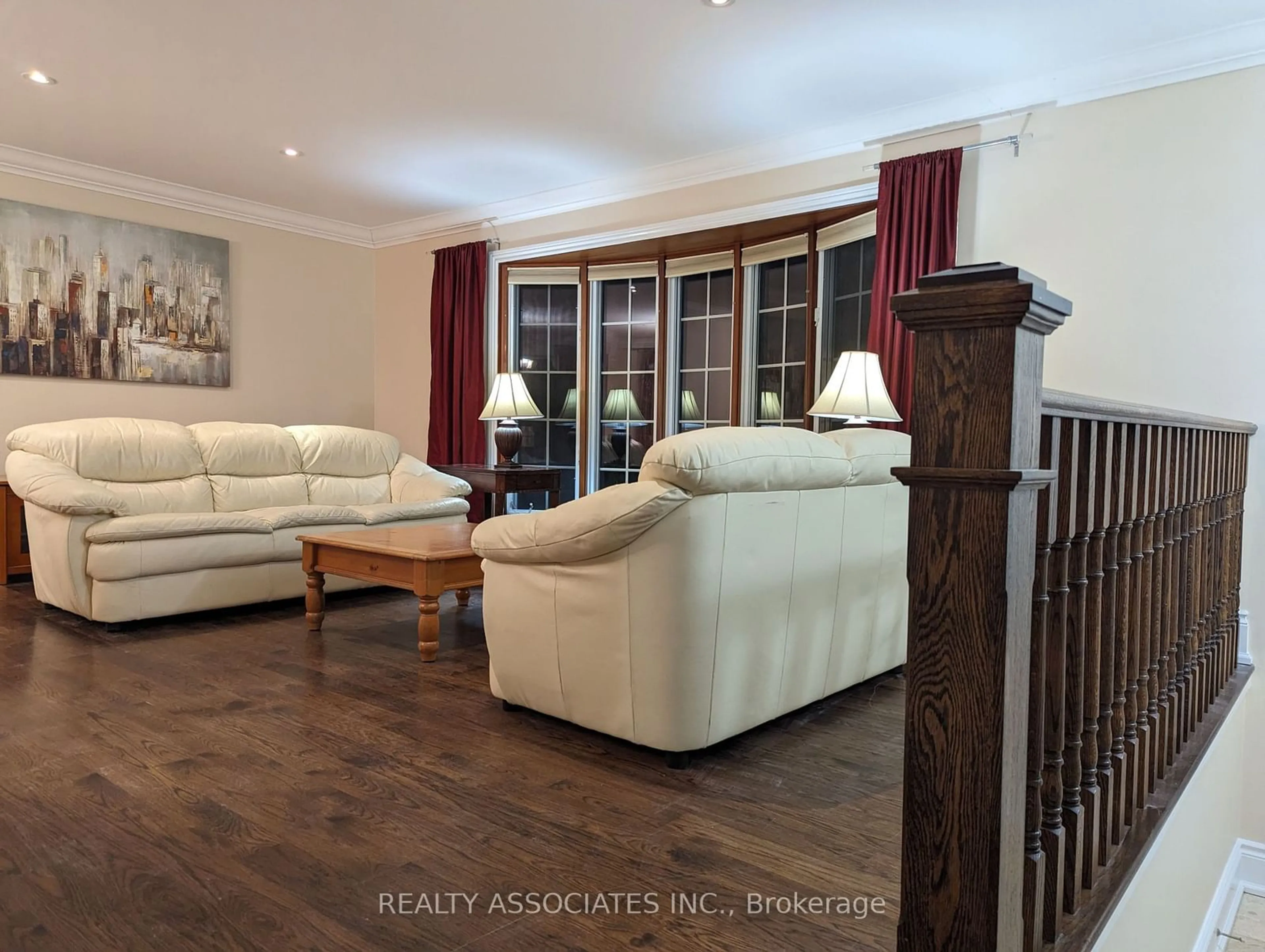 Living room with furniture, wood/laminate floor for 1654 Stonehaven Dr, Mississauga Ontario L5J 1E7