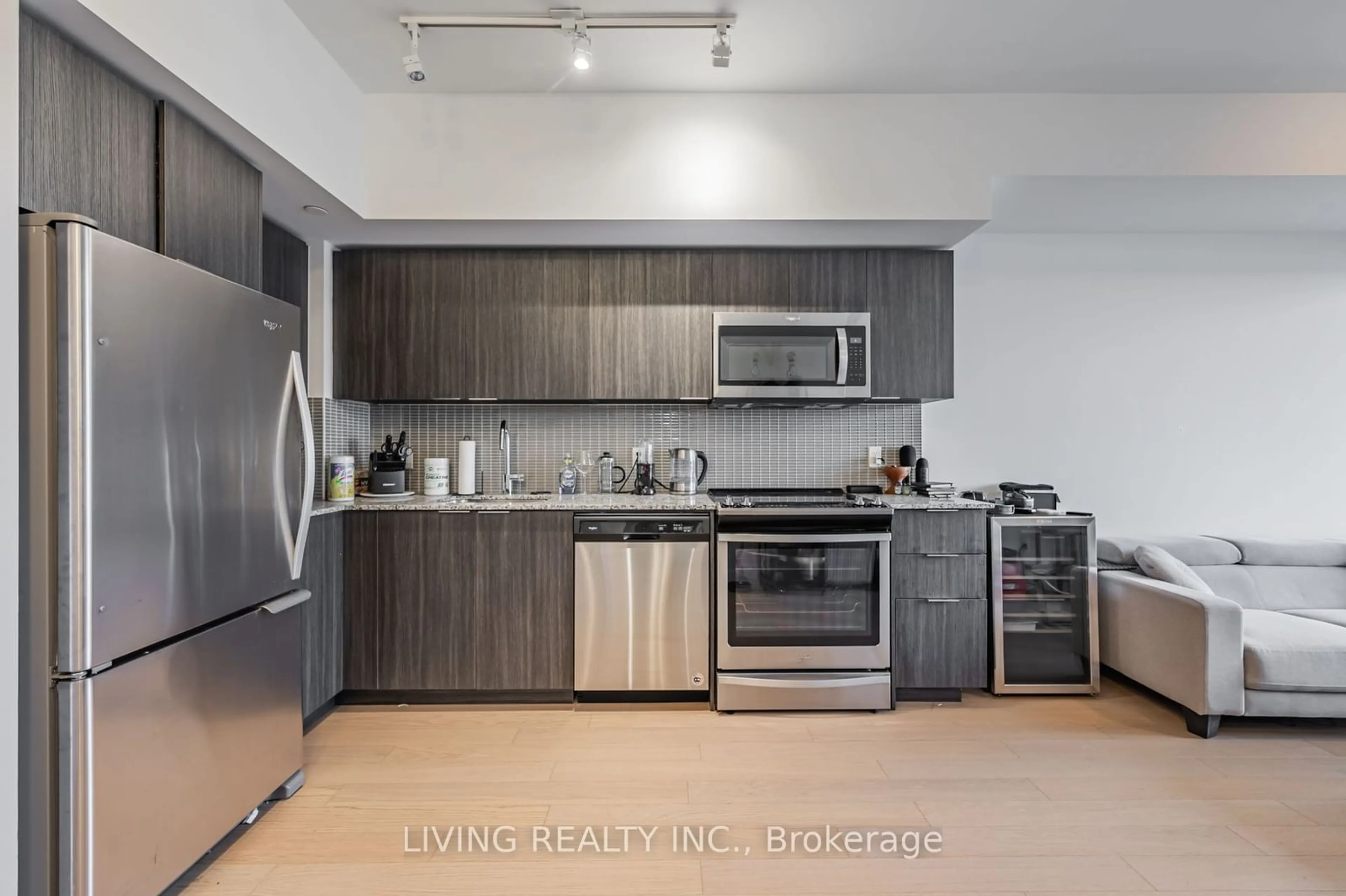 Kitchen with laundary machines, wood floors for 20 Shore Breeze Dr #2606, Toronto Ontario M8V 0C7