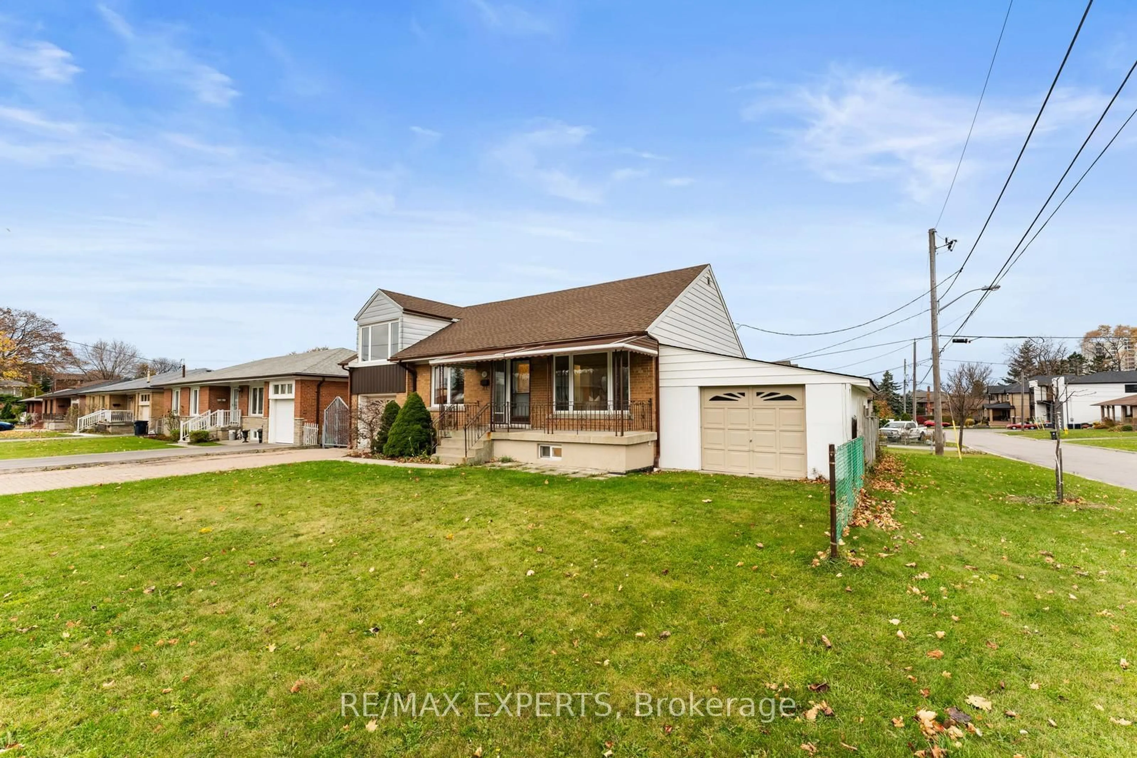 Frontside or backside of a home, the fenced backyard for 10 Fleetwood Ave, Toronto Ontario M6L 2Z1