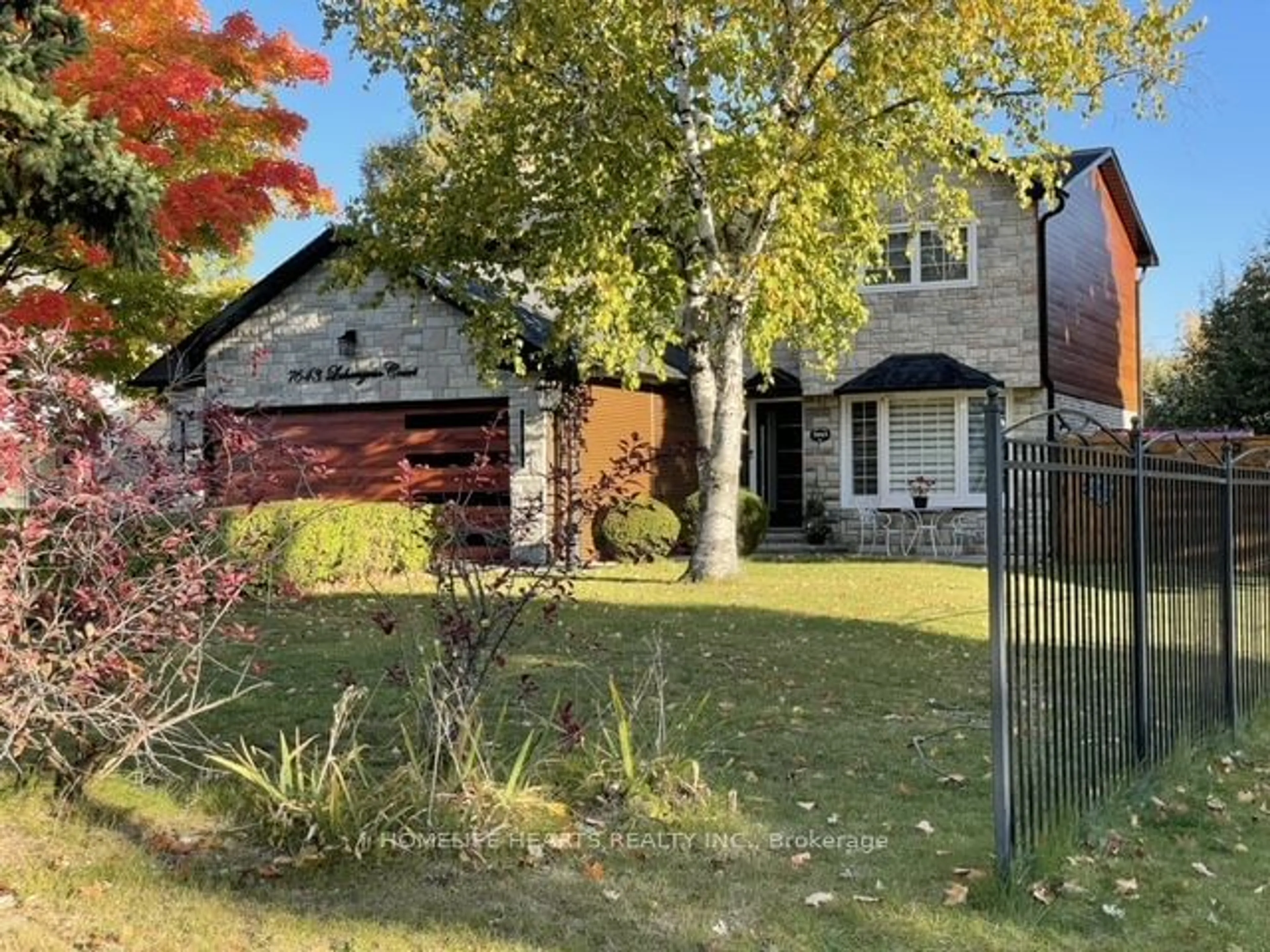 Frontside or backside of a home, the fenced backyard for 7643 Lohengrin Crt, Mississauga Ontario L4T 3J1