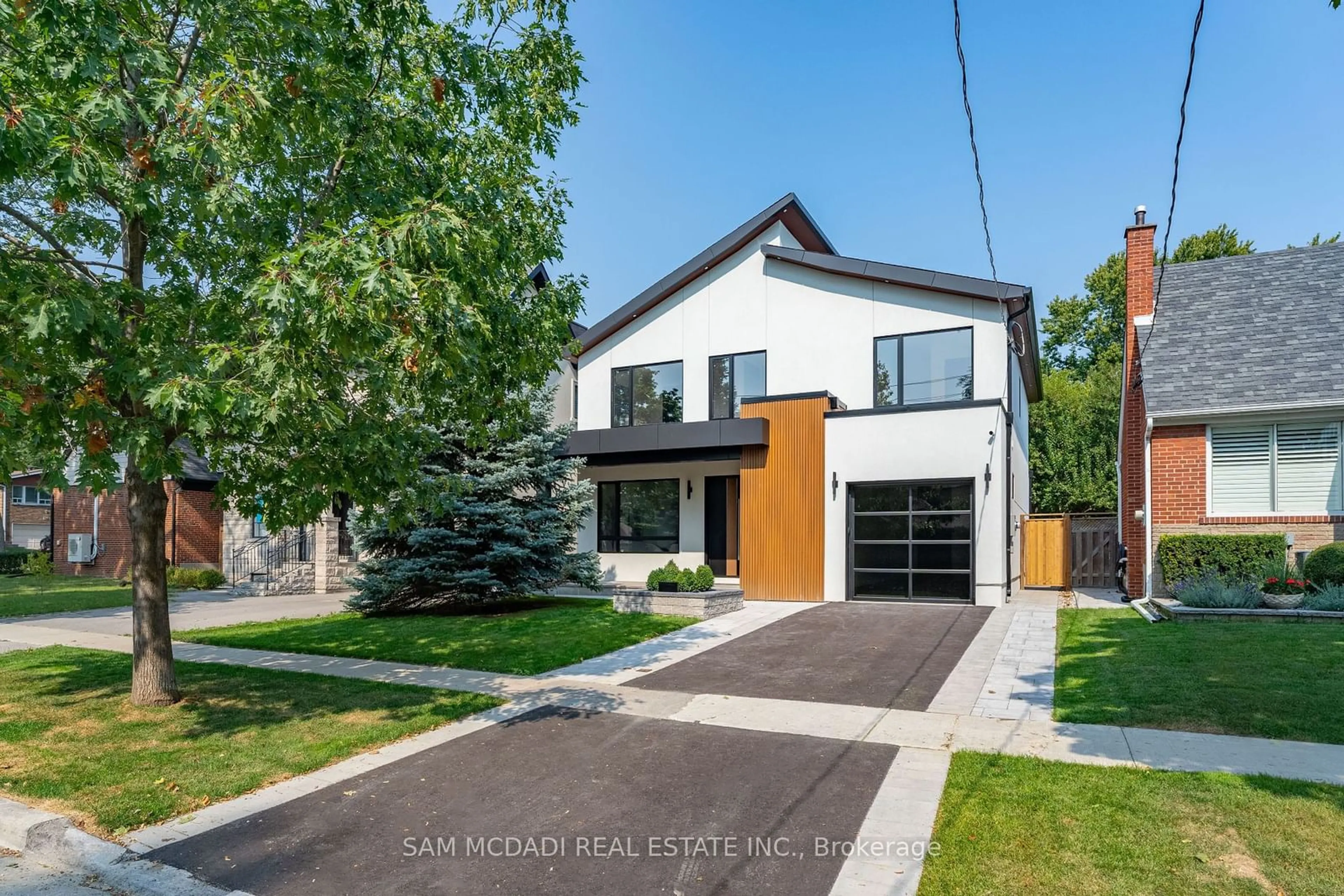 Frontside or backside of a home, the street view for 32 Swan Ave, Toronto Ontario M9B 1V4