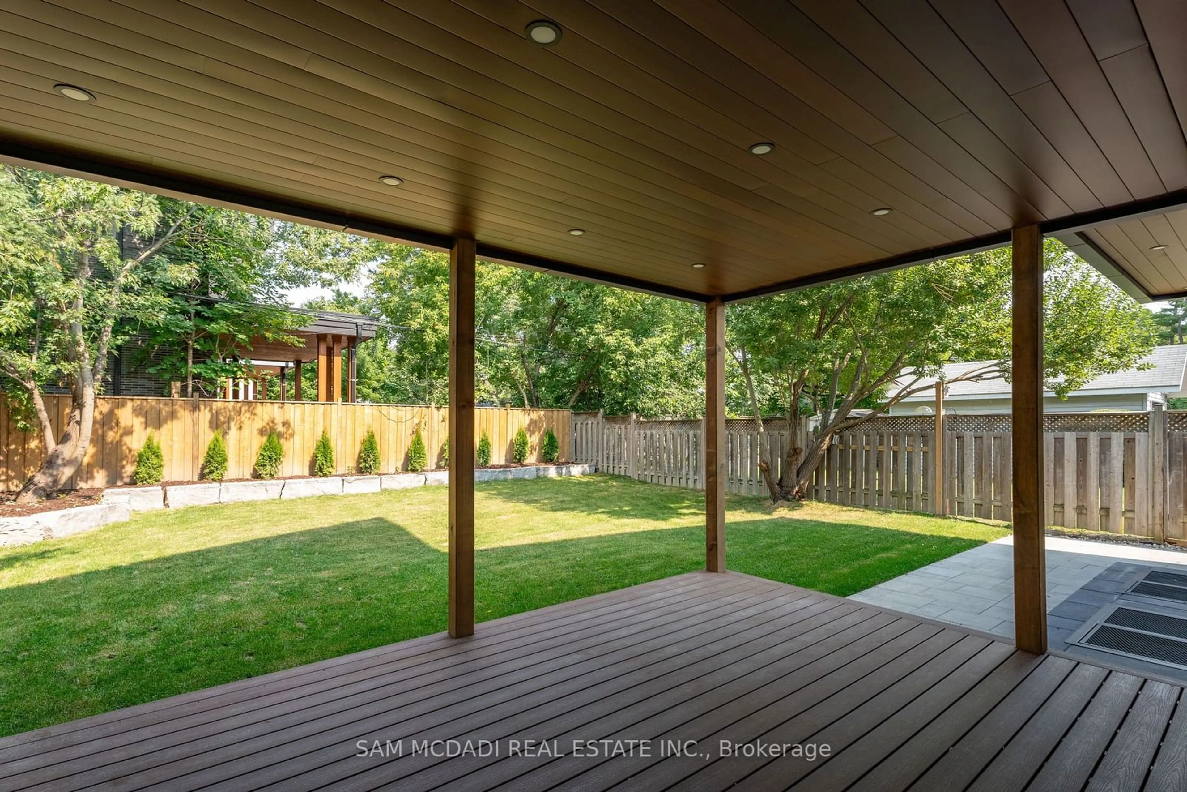 Patio, the fenced backyard for 32 Swan Ave, Toronto Ontario M9B 1V4