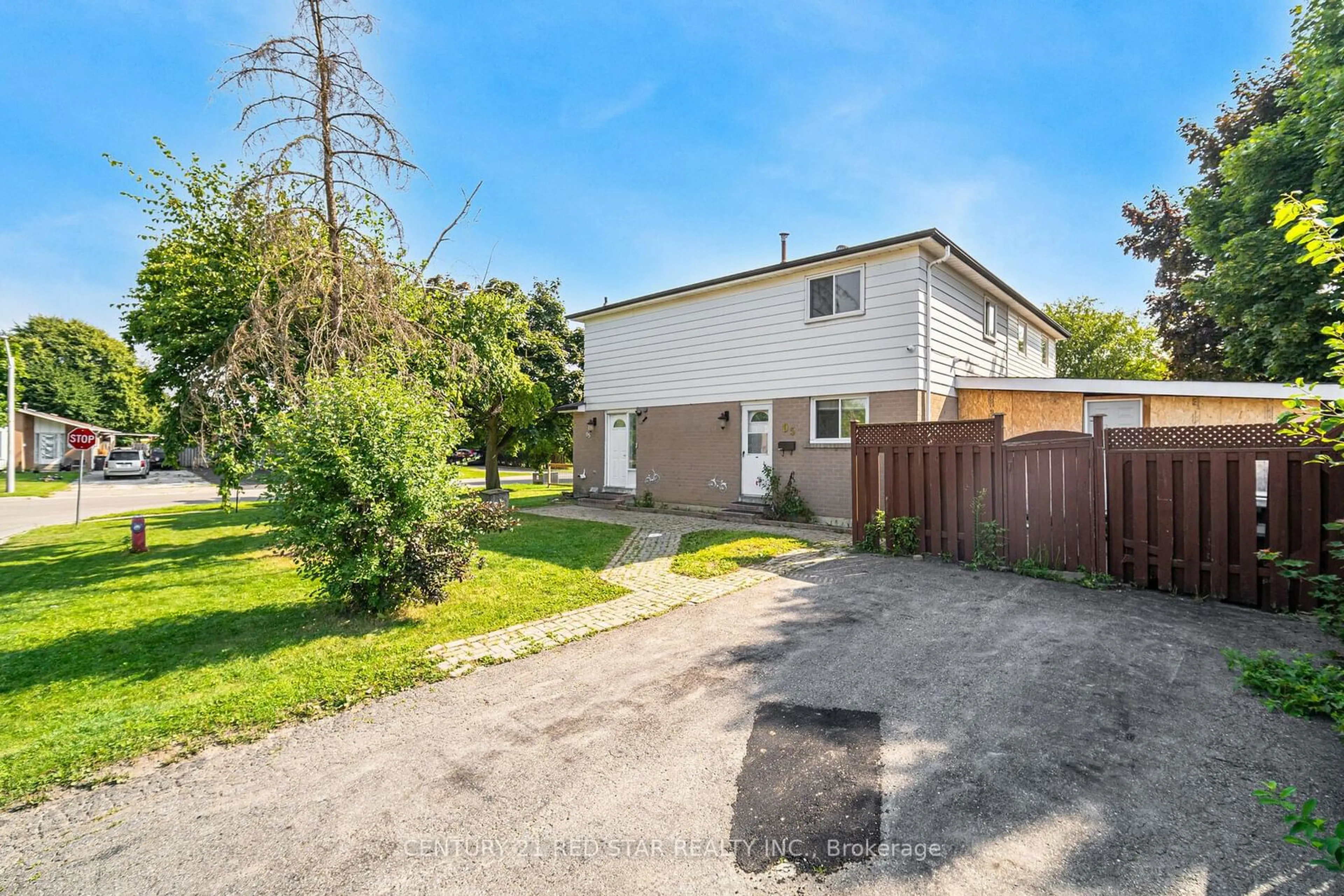 Frontside or backside of a home, the fenced backyard for 95 Glenmore Cres, Brampton Ontario L6S 1H9