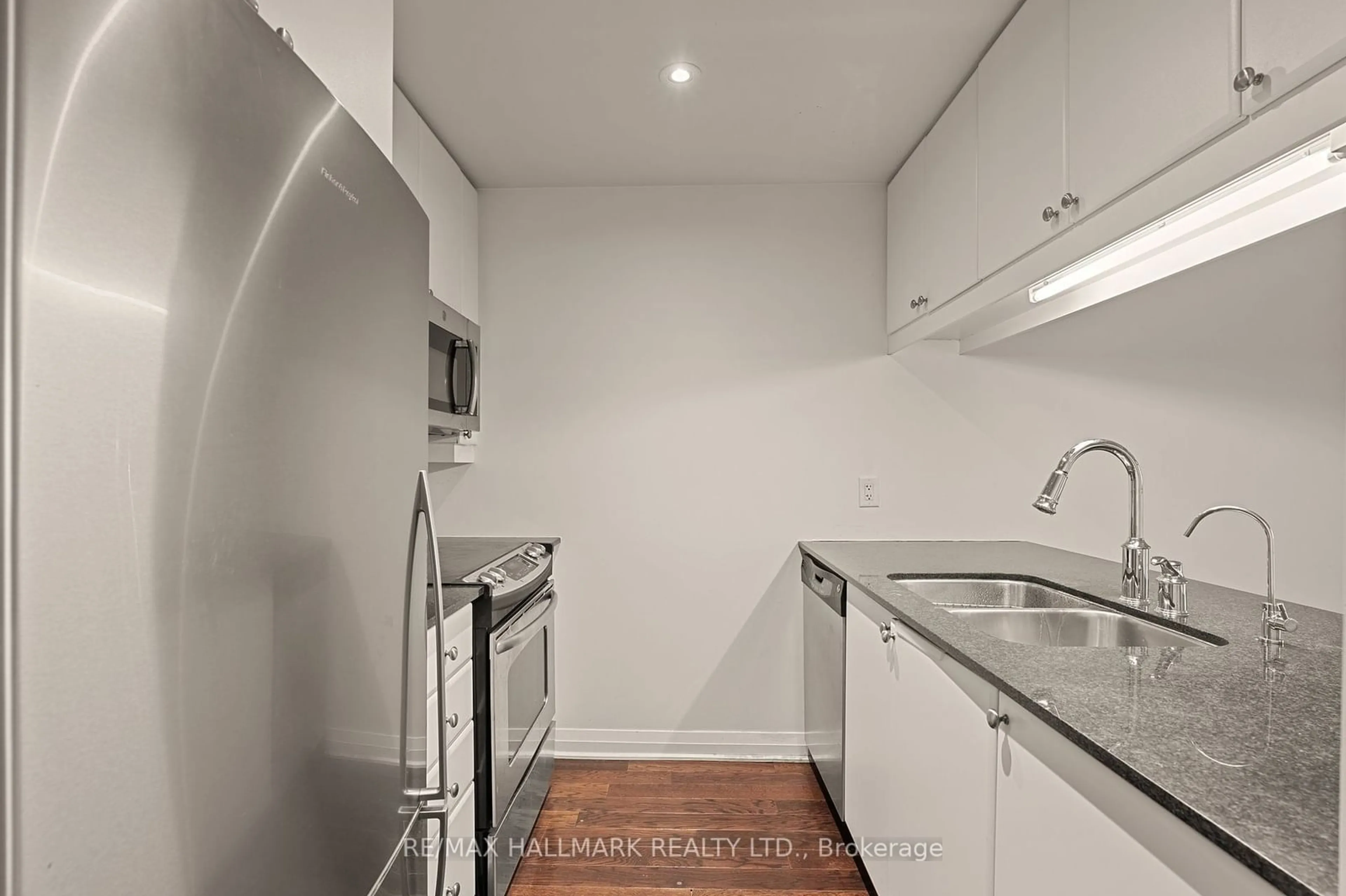 Standard kitchen, wood floors, the street view for 1055 Southdown Rd #1209, Mississauga Ontario L5J 0A3