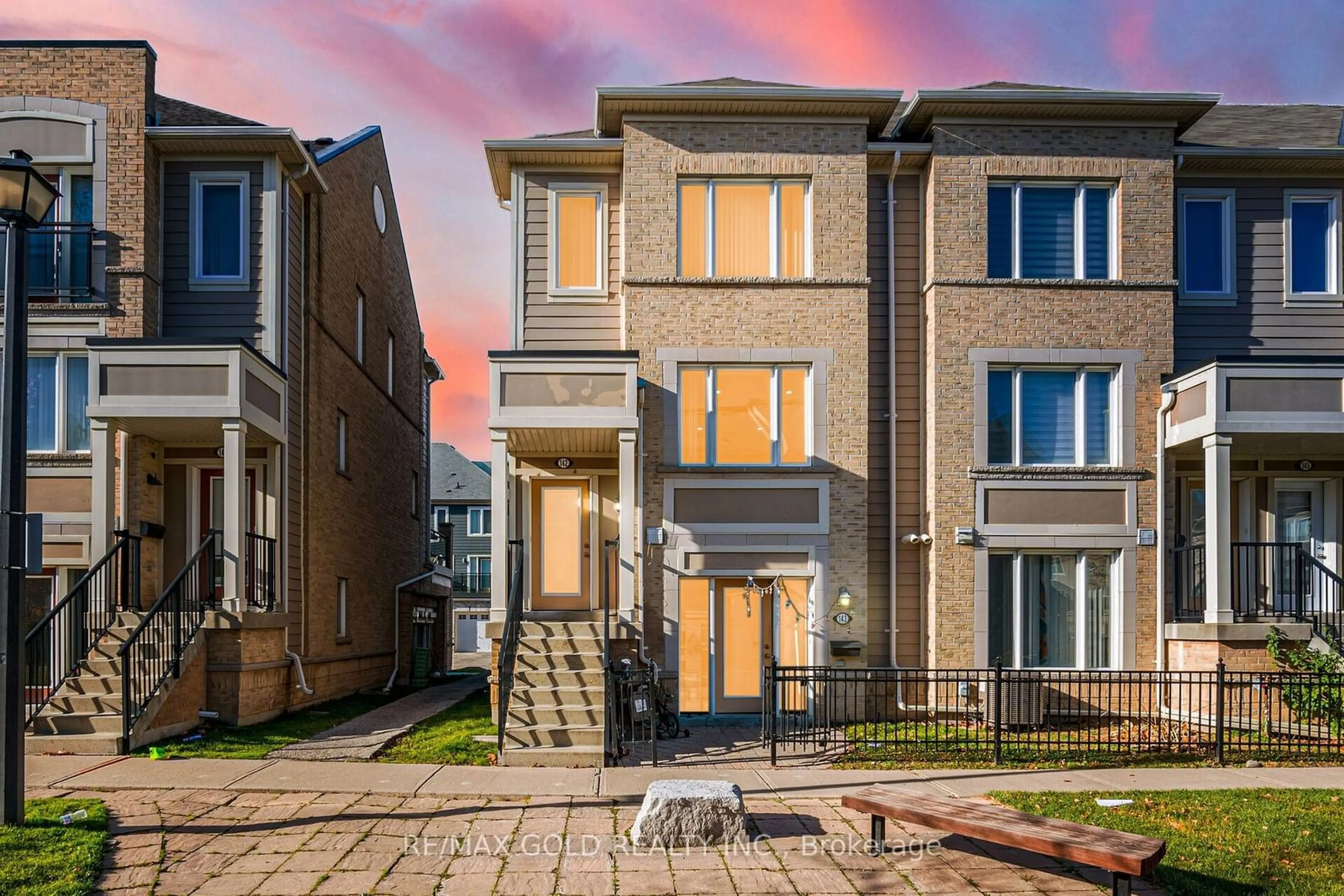 A pic from exterior of the house or condo, the fenced backyard for 60 Fairwood Circ #142, Brampton Ontario L6R 0Y6