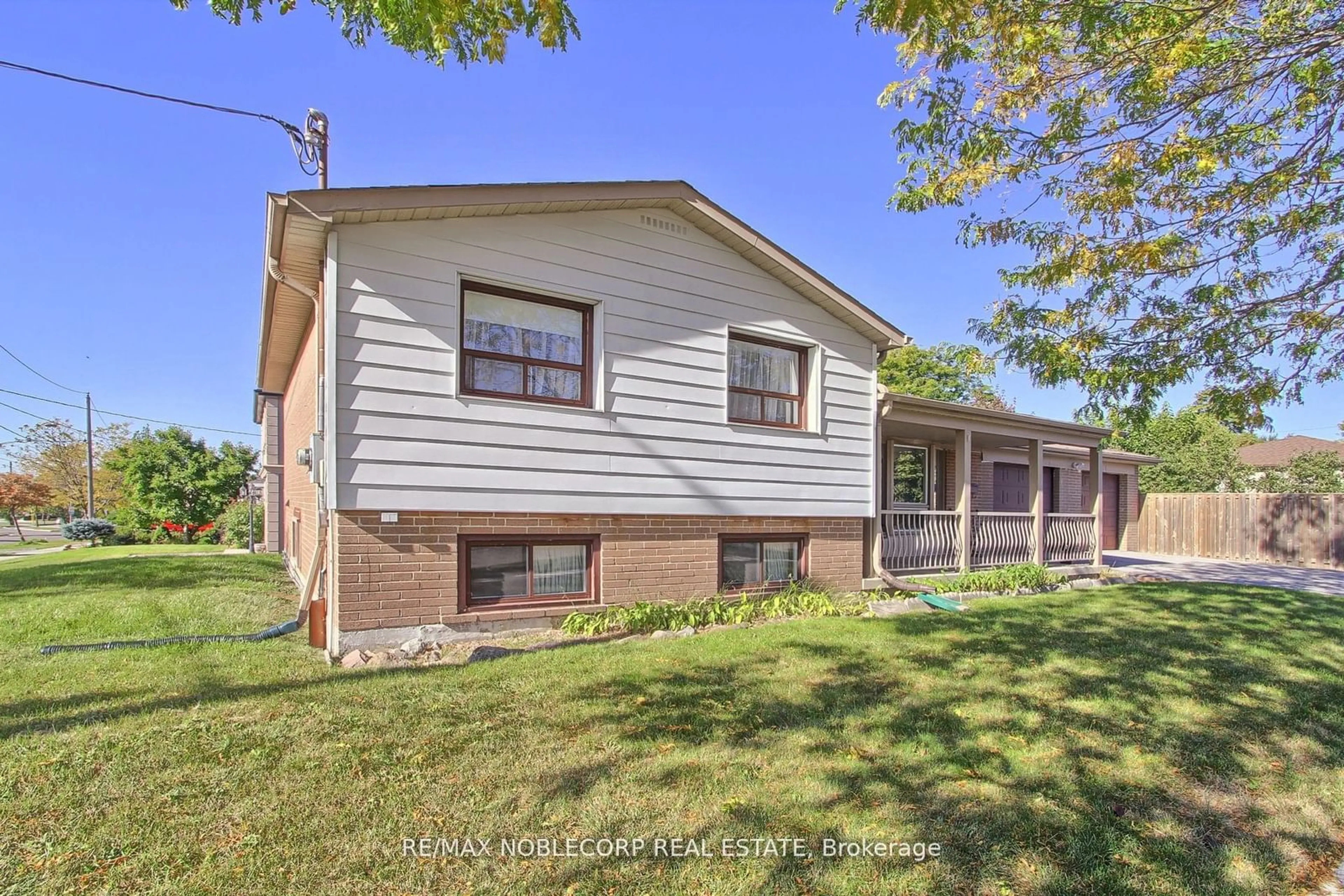 A pic from exterior of the house or condo, the fenced backyard for 22 Bimini Cres, Toronto Ontario M3N 1R9