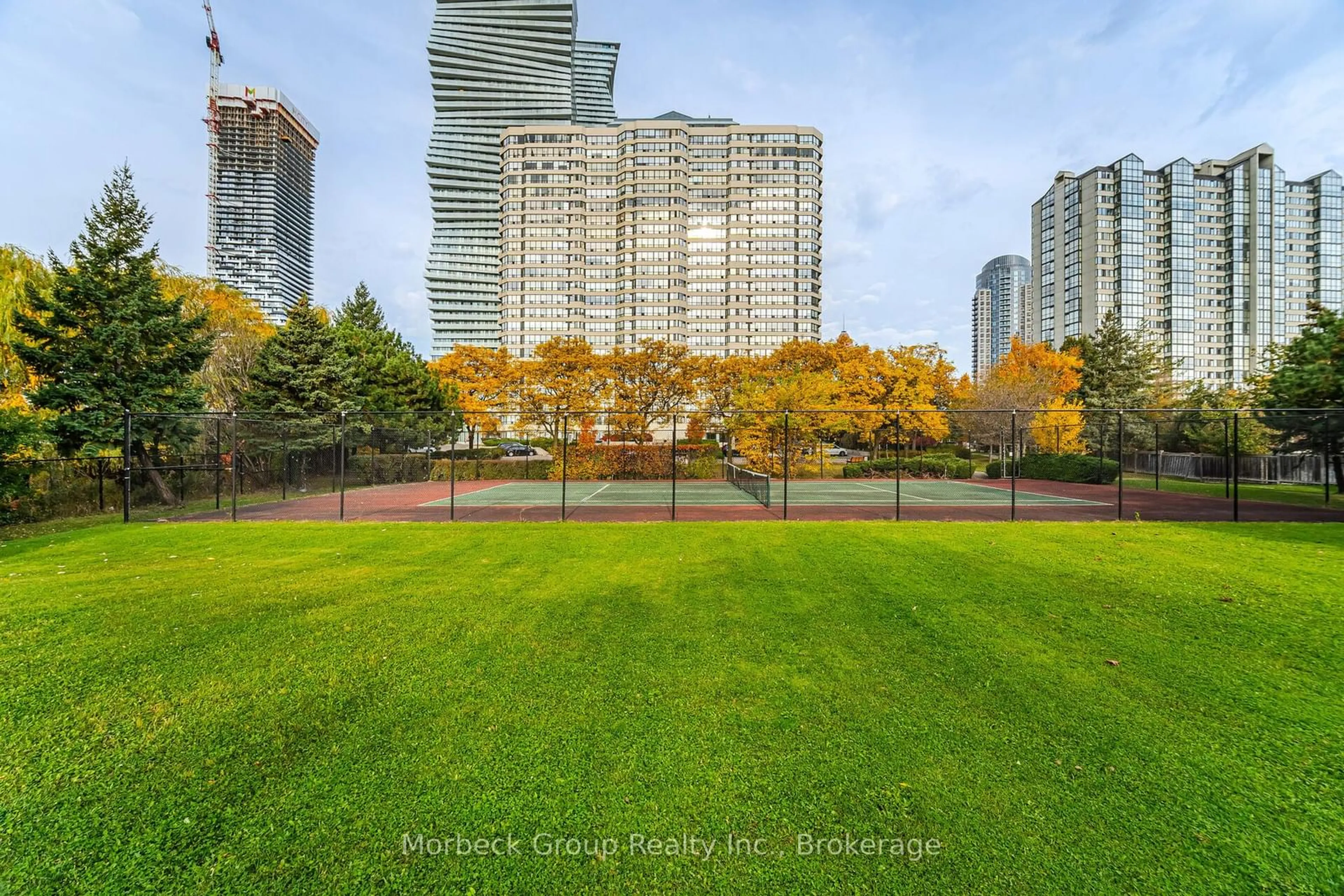 A pic from exterior of the house or condo, the fenced backyard for 400 WEBB Dr #1004, Mississauga Ontario L5B 3Z7