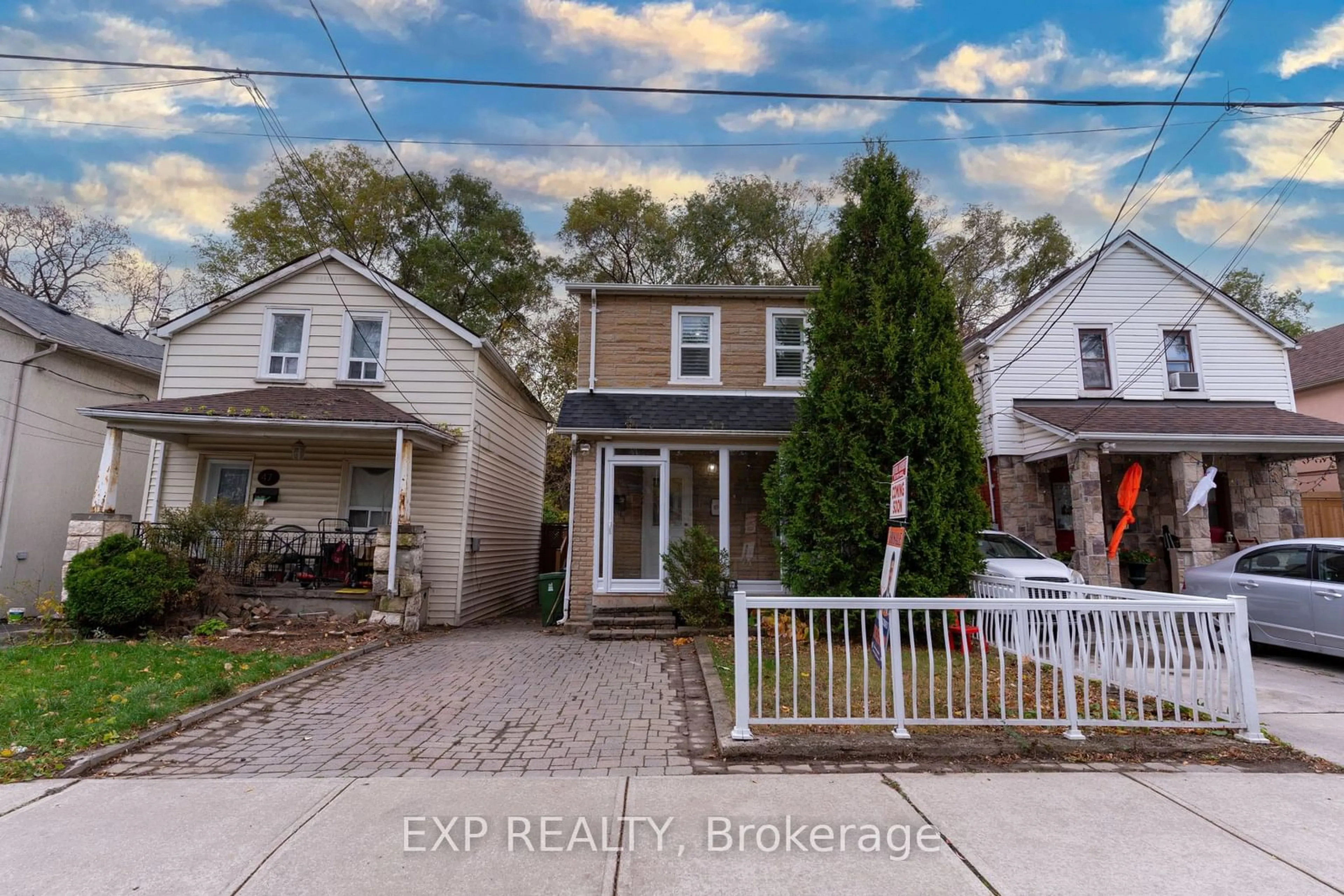 Frontside or backside of a home, the fenced backyard for 49 Hillary Ave, Toronto Ontario M6N 2C1