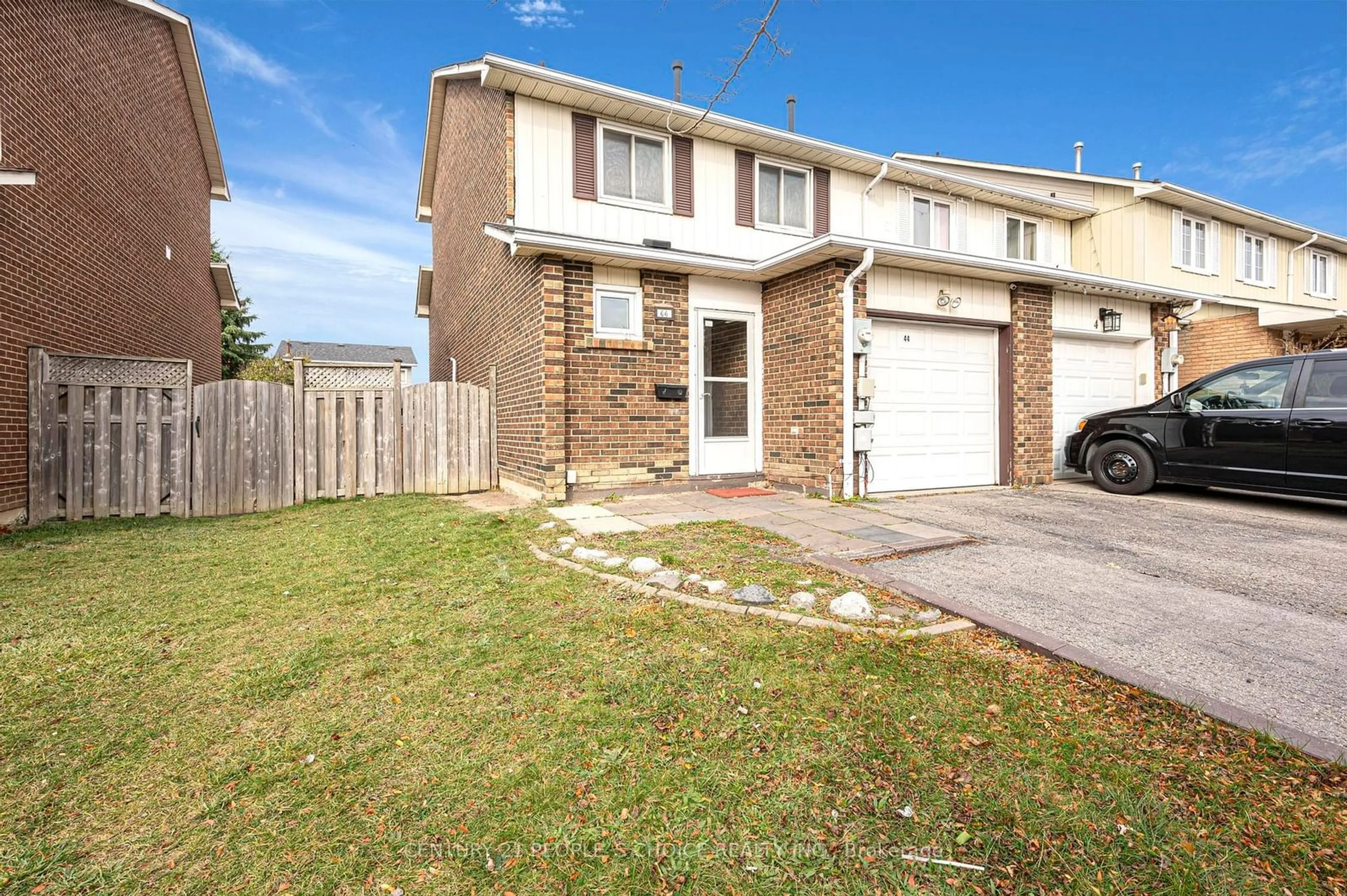 A pic from exterior of the house or condo, the fenced backyard for 44 Rusthall Way, Brampton Ontario L6V 3R6