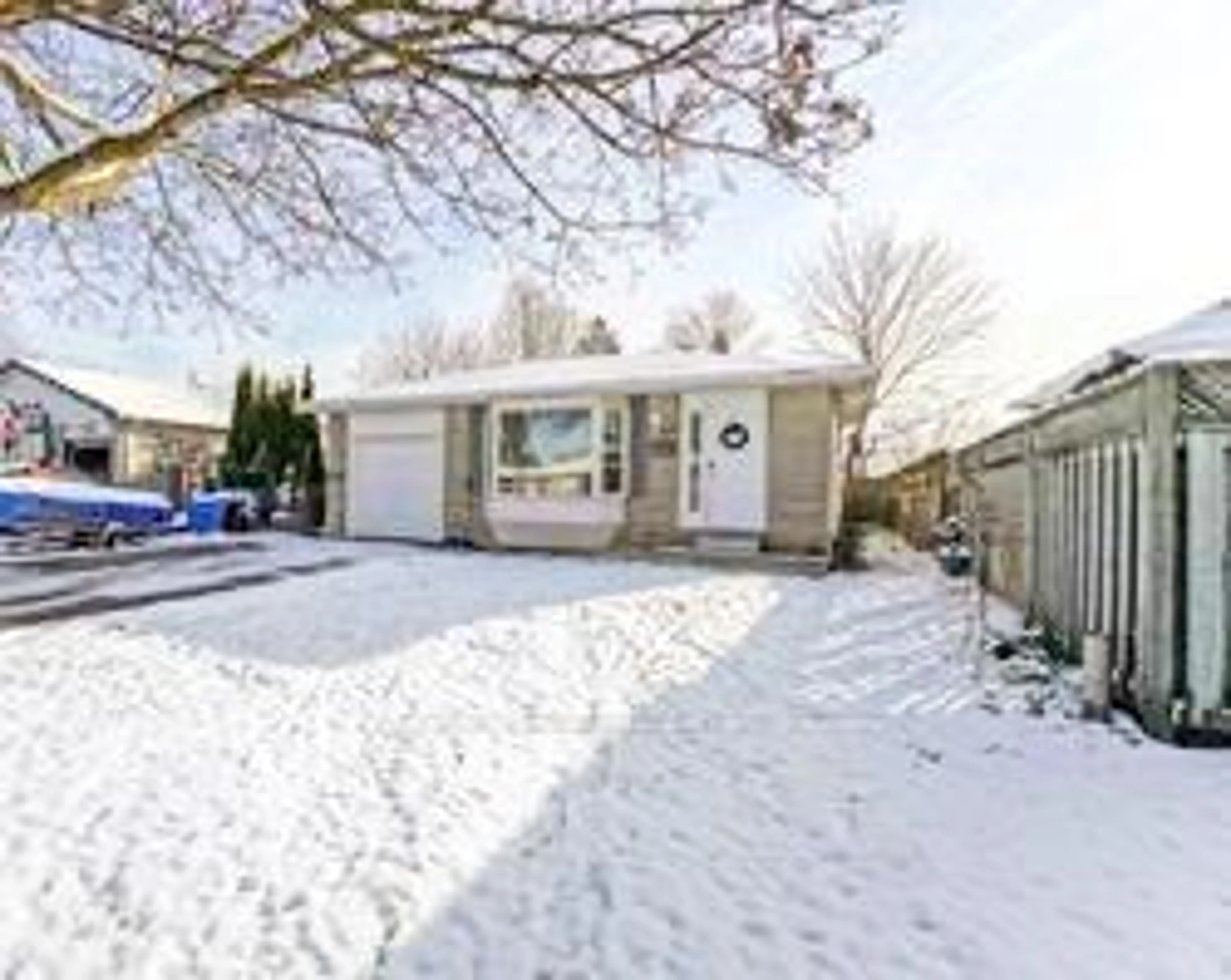 Frontside or backside of a home, the fenced backyard for 48 Madison Ave, Orangeville Ontario L9W 1S3