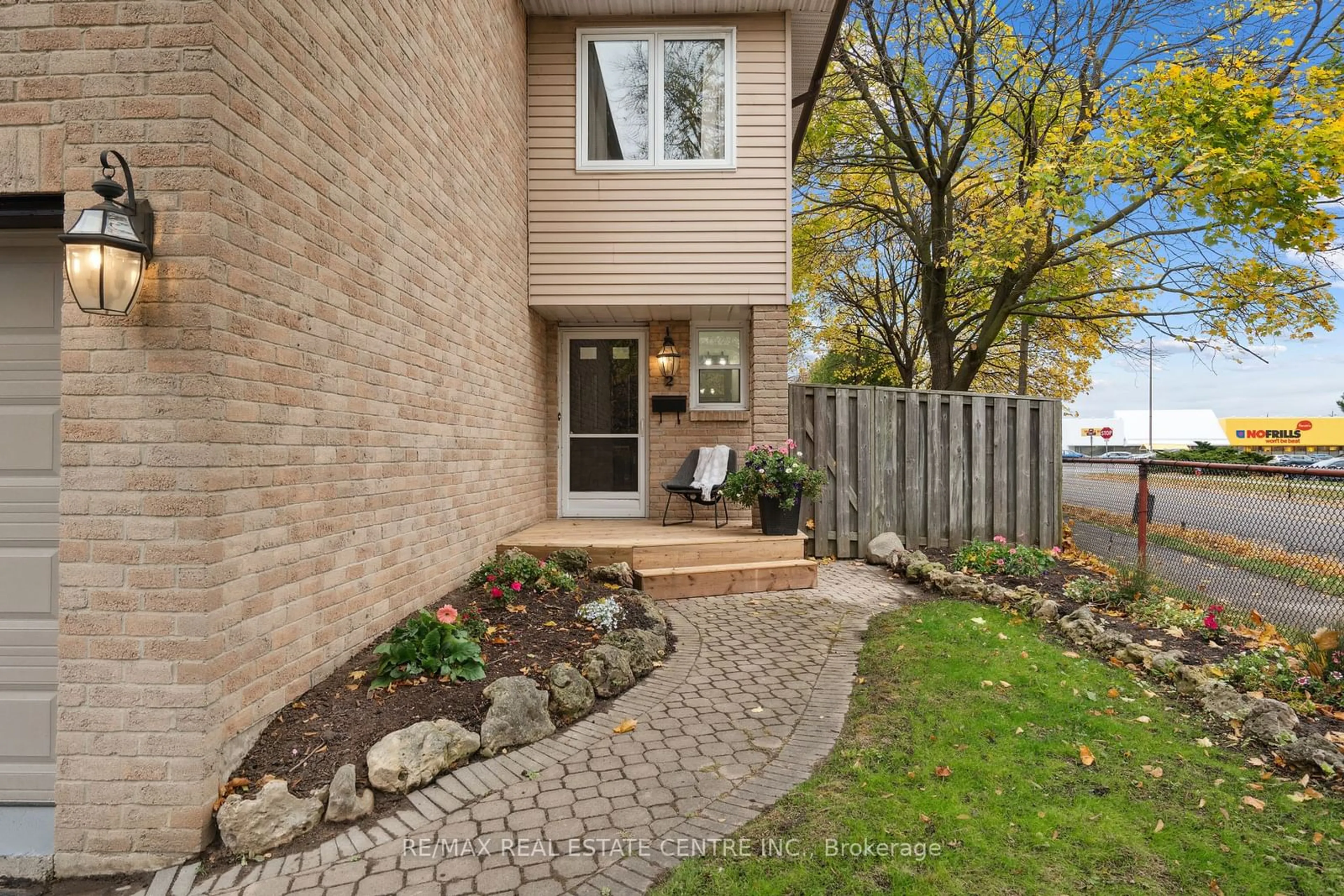 A pic from exterior of the house or condo, the fenced backyard for 2 Blossom Ave, Brampton Ontario L6X 2W3