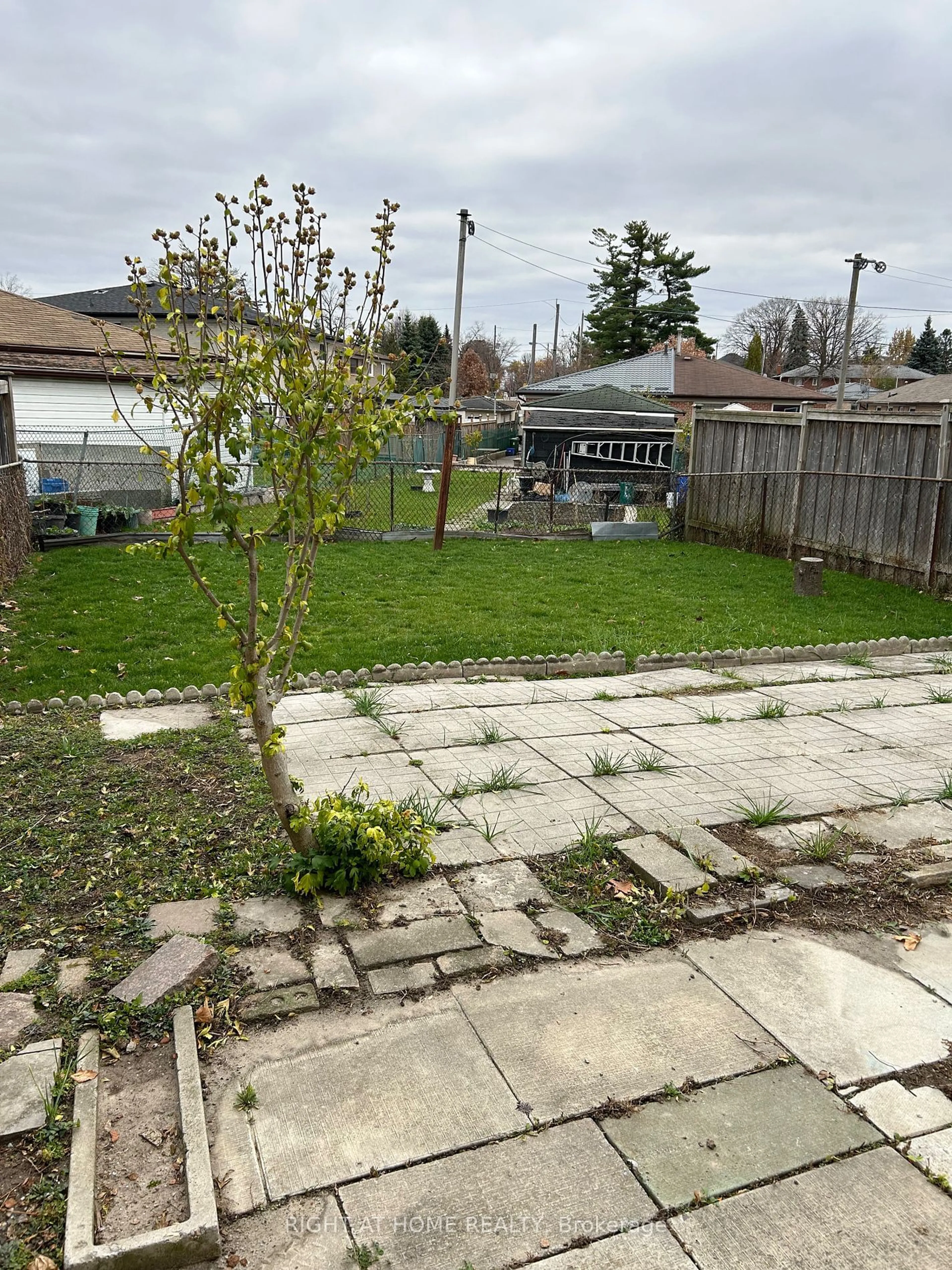 Patio, the fenced backyard for 65 Primula Cres, Toronto Ontario M9L 1J9