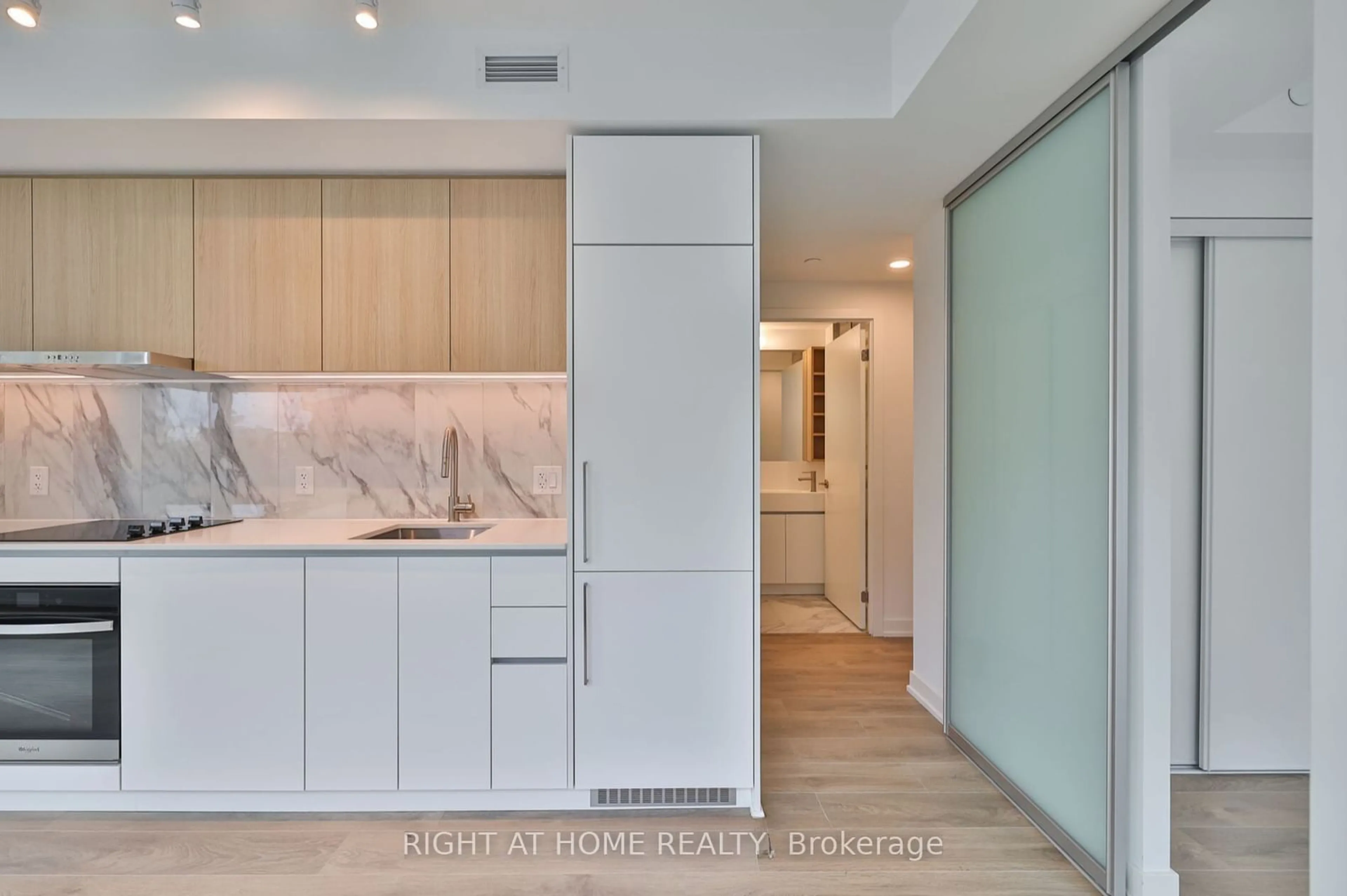 Contemporary kitchen, wood floors for 1100 Sheppard Ave #208, Toronto Ontario M3K 0E4