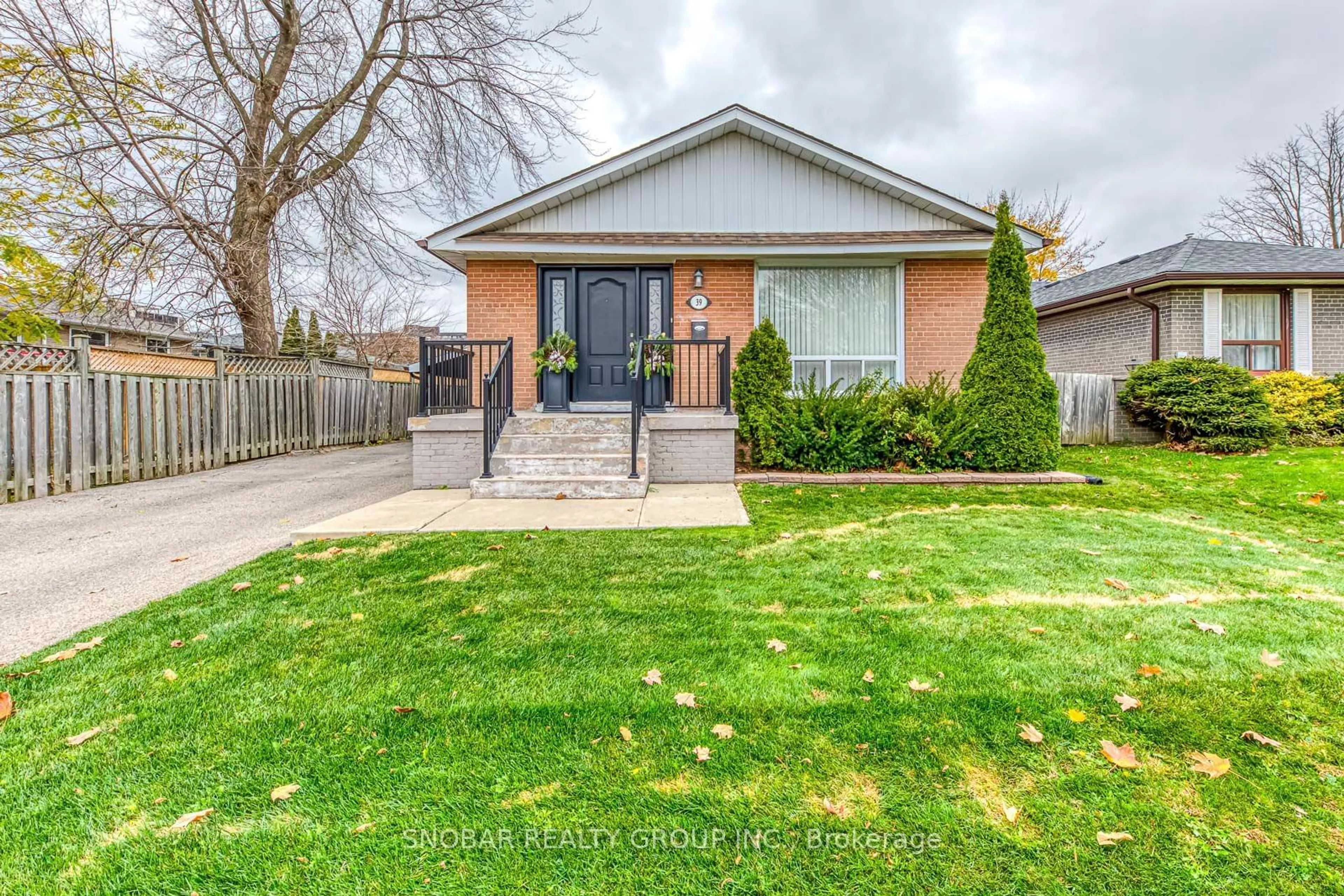 Frontside or backside of a home, the fenced backyard for 39 Buckley Cres, Toronto Ontario M9R 3K4