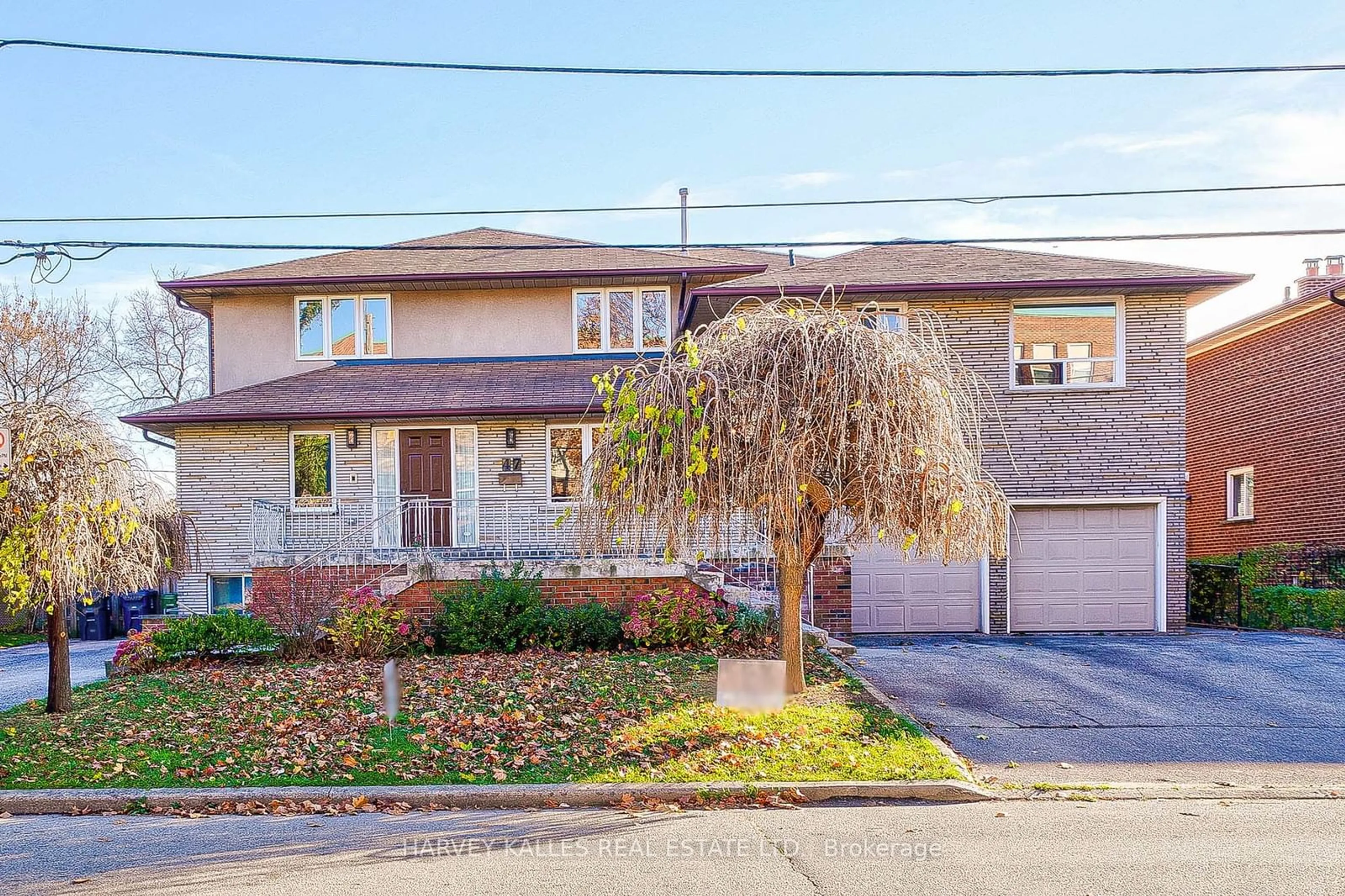 Frontside or backside of a home, the street view for 47 Claver Ave, Toronto Ontario M6B 2V9