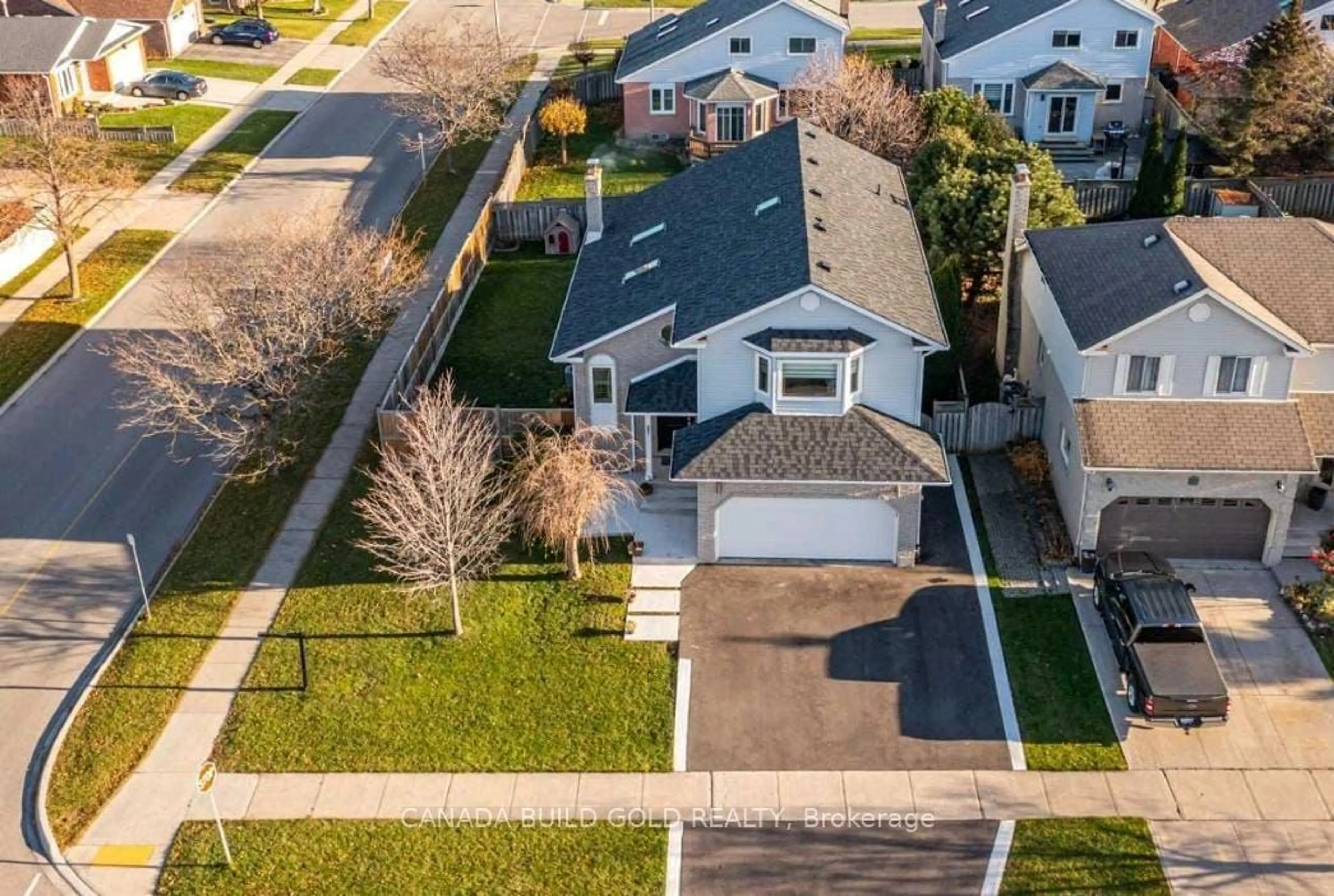 Frontside or backside of a home, the fenced backyard for 2211 Heidi Ave, Burlington Ontario L7M 3W5