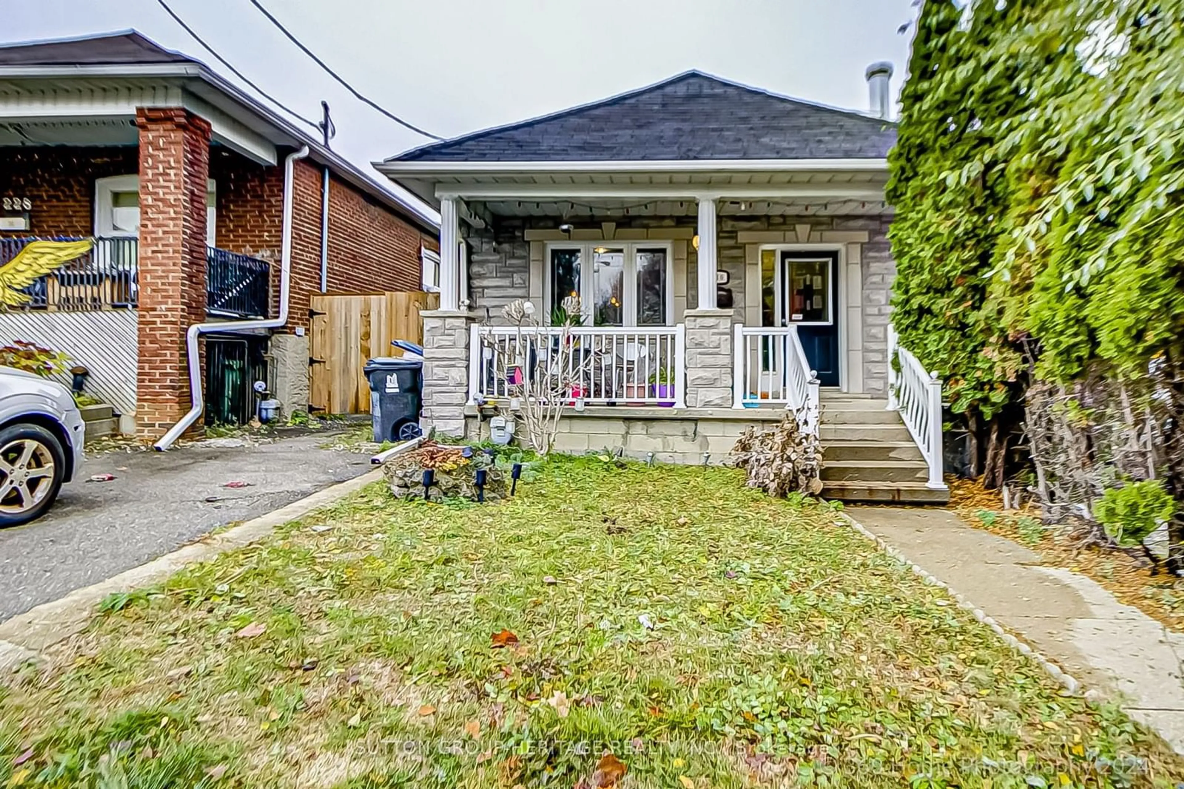 Frontside or backside of a home, cottage for 230 Gilbert Ave, Toronto Ontario M6E 4W5