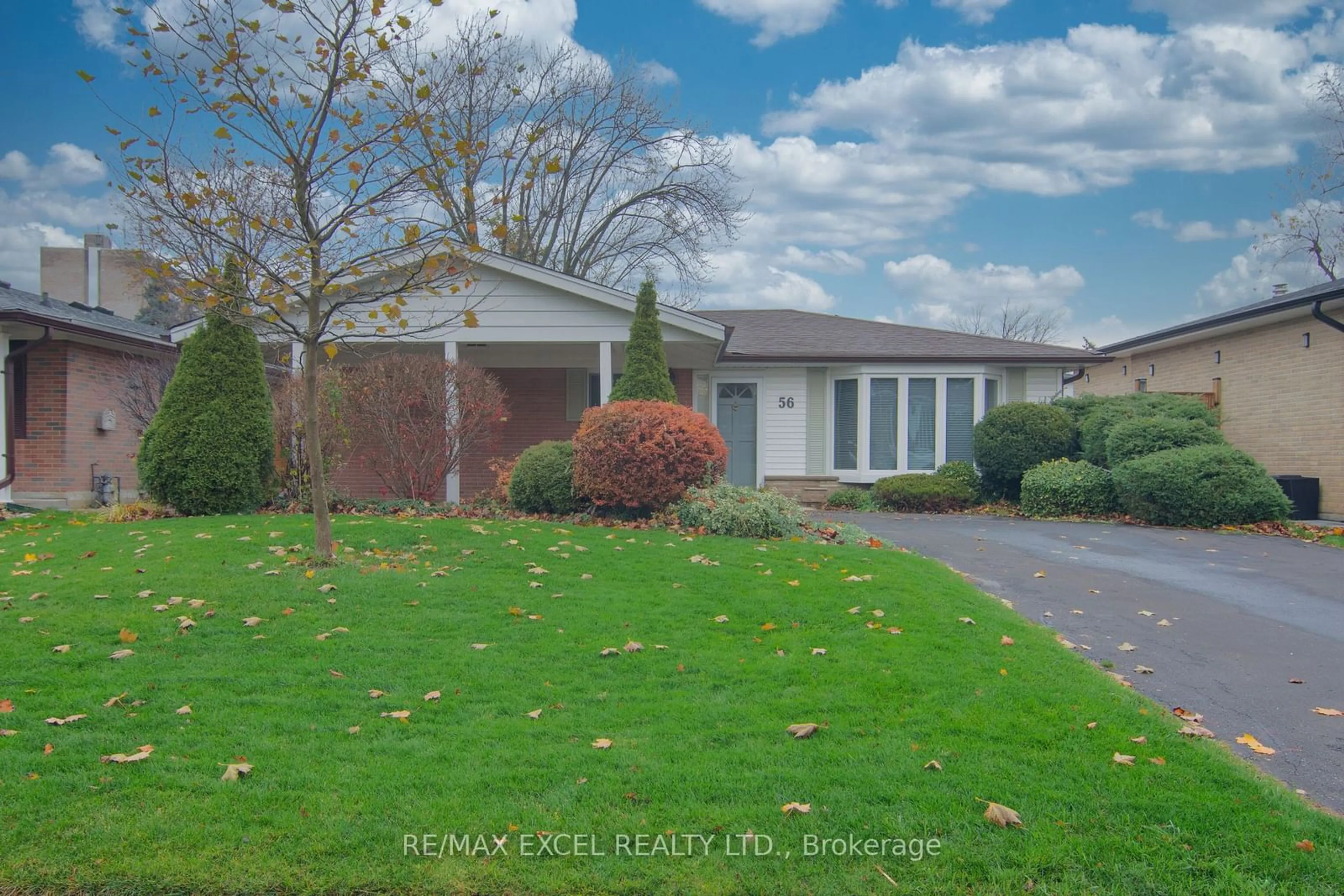 A pic from exterior of the house or condo, the fenced backyard for 56 Farmington Dr, Brampton Ontario L6W 2V2