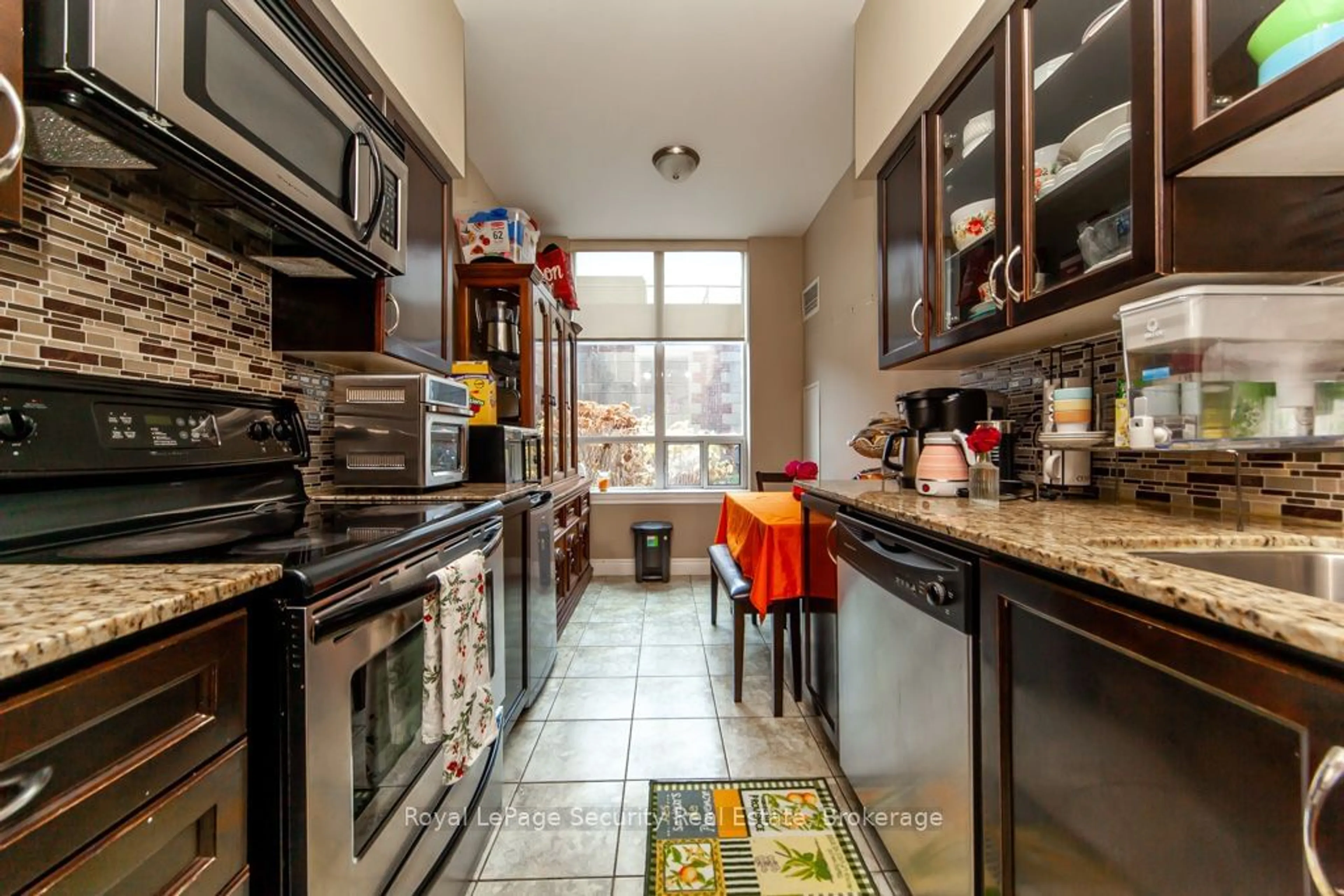 Kitchen, ceramic floors, the street view for 2772 Keele St #105, Toronto Ontario M3M 0A3