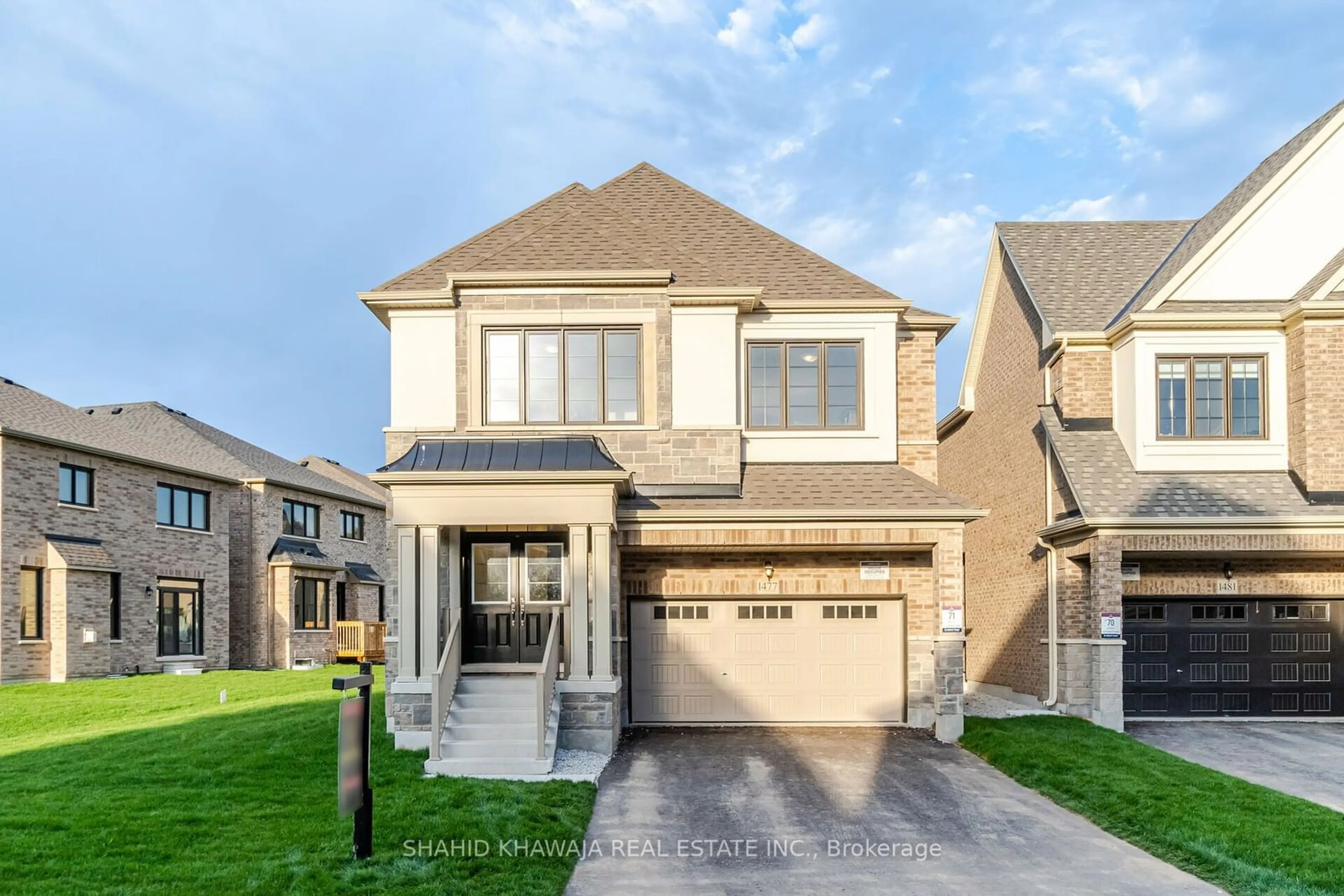 Frontside or backside of a home, the street view for 1477 Strawberry Landing, Milton Ontario L9E 1Y8