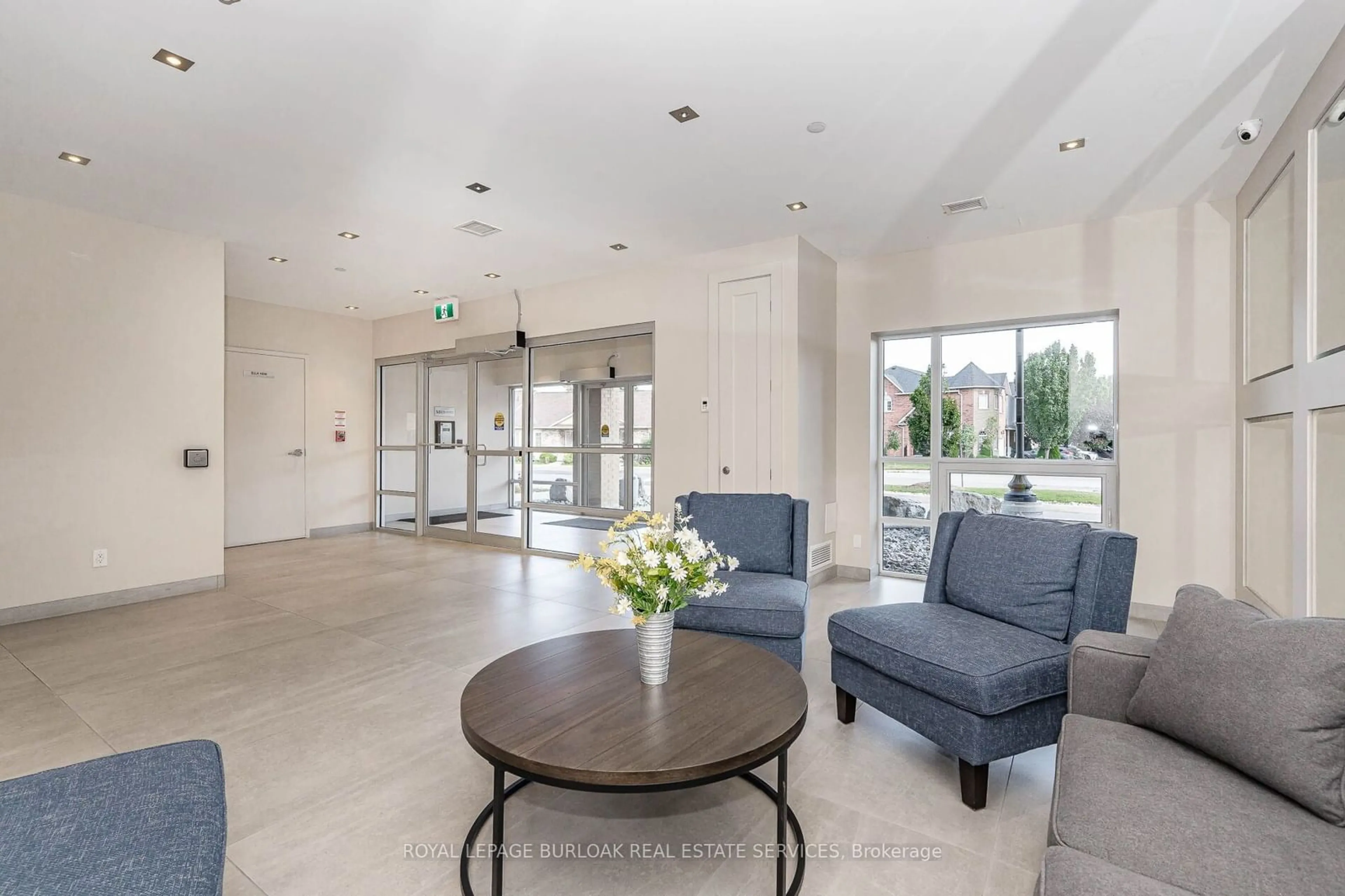 Indoor lobby, cement floor for 4040 Upper Middle Rd #106, Burlington Ontario L7M 0H2