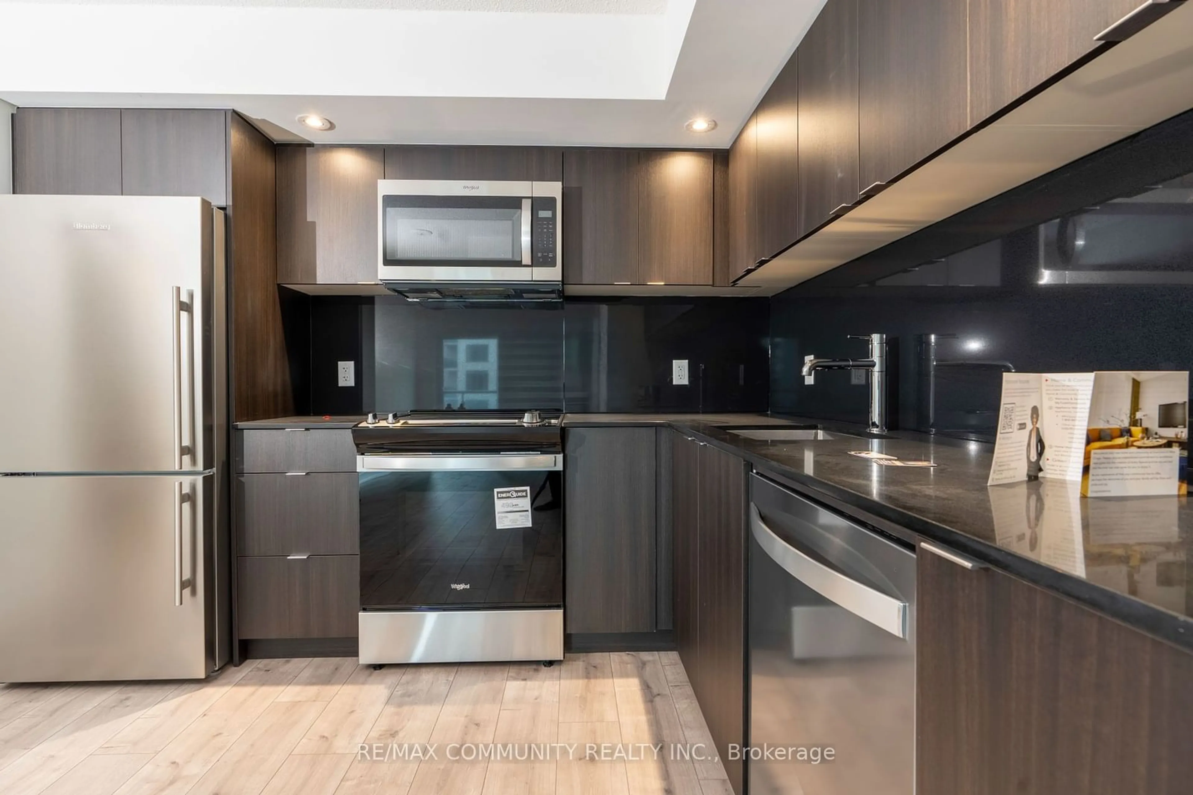 Standard kitchen, wood floors for 10 Eva Rd #301, Toronto Ontario M9C 0B3