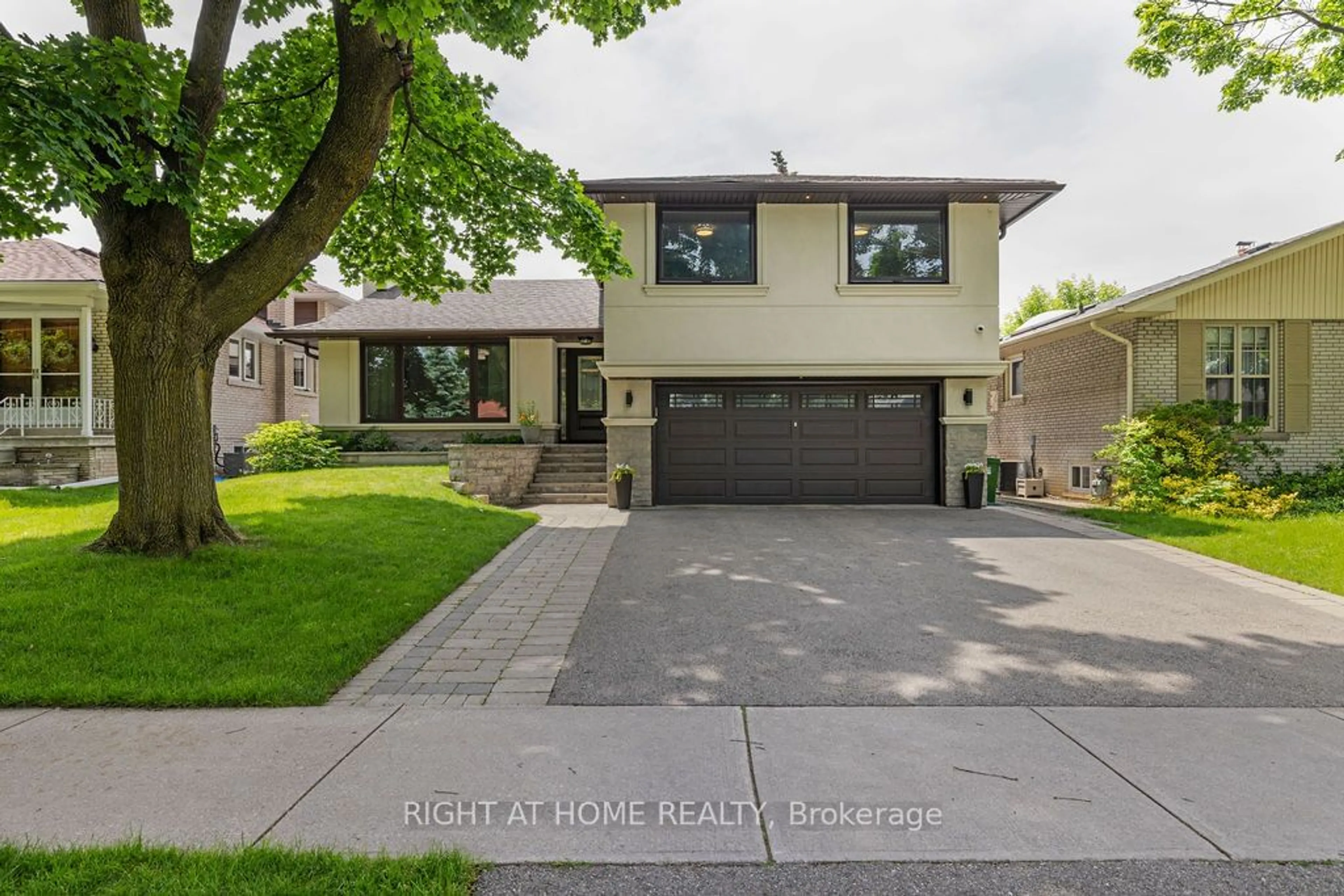 Frontside or backside of a home, the street view for 14 Downpatrick Cres, Toronto Ontario M9R 4A4