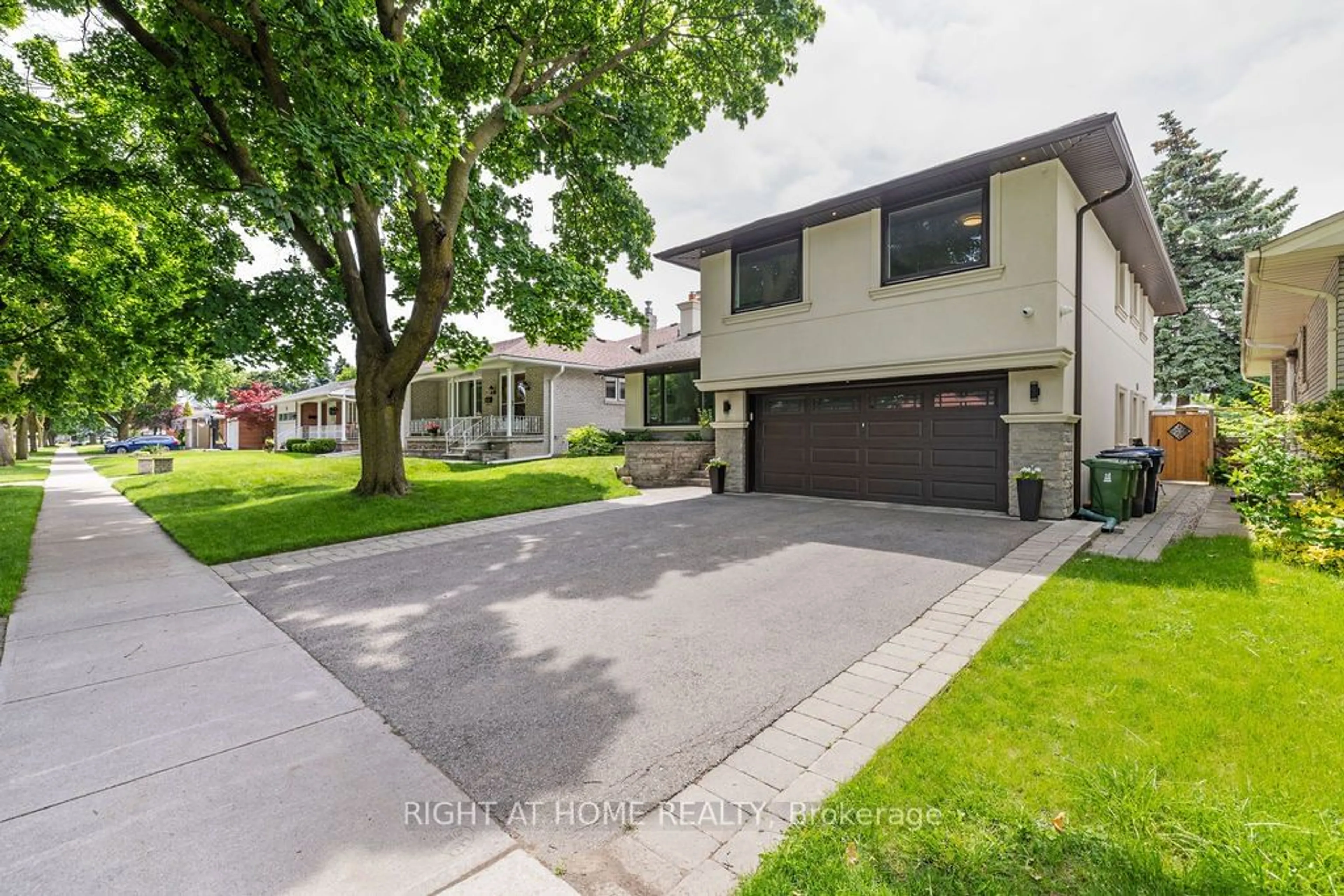 Frontside or backside of a home, the street view for 14 Downpatrick Cres, Toronto Ontario M9R 4A4