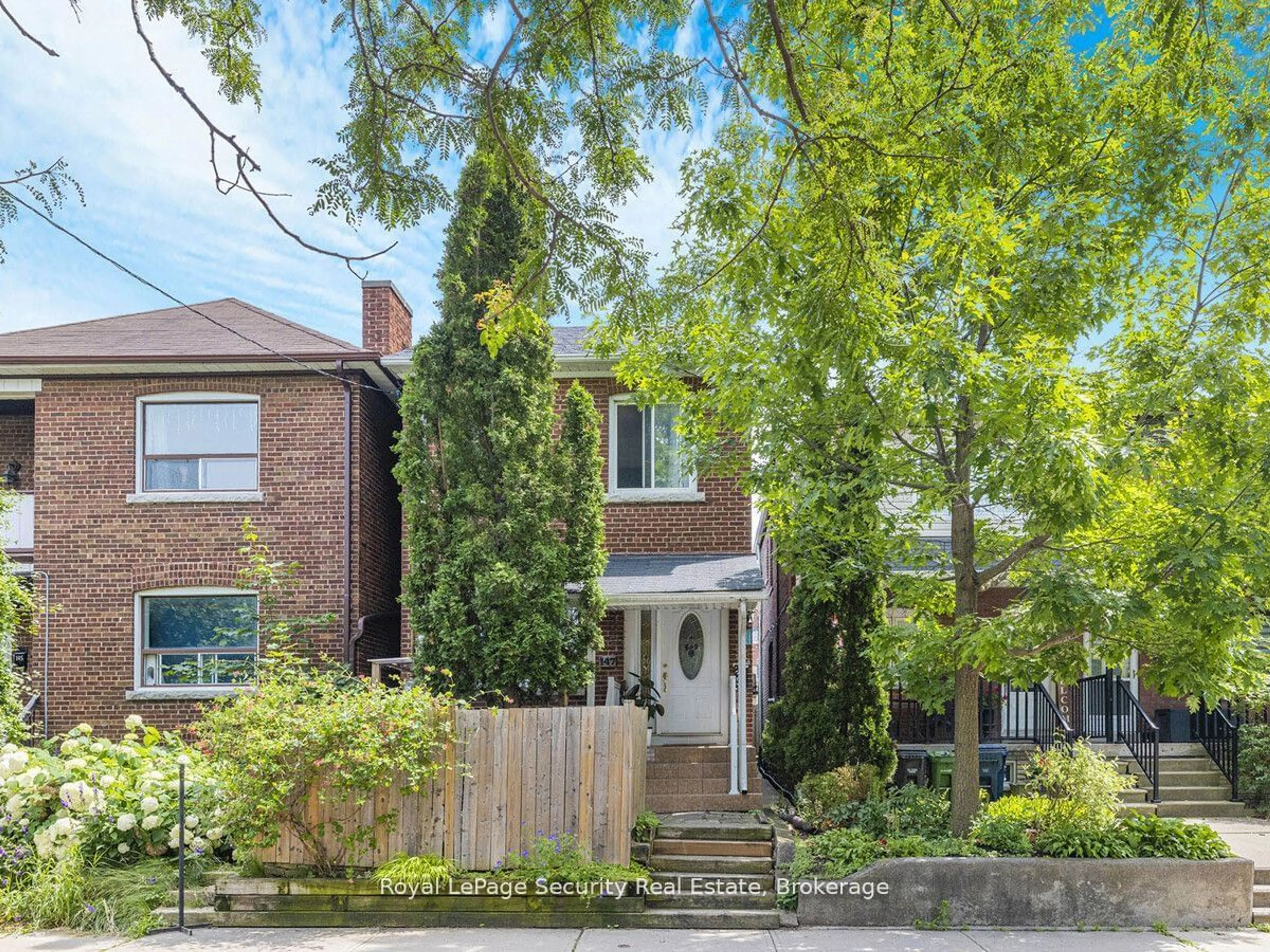 Frontside or backside of a home, the street view for 147 Hope St, Toronto Ontario M6E 1K4