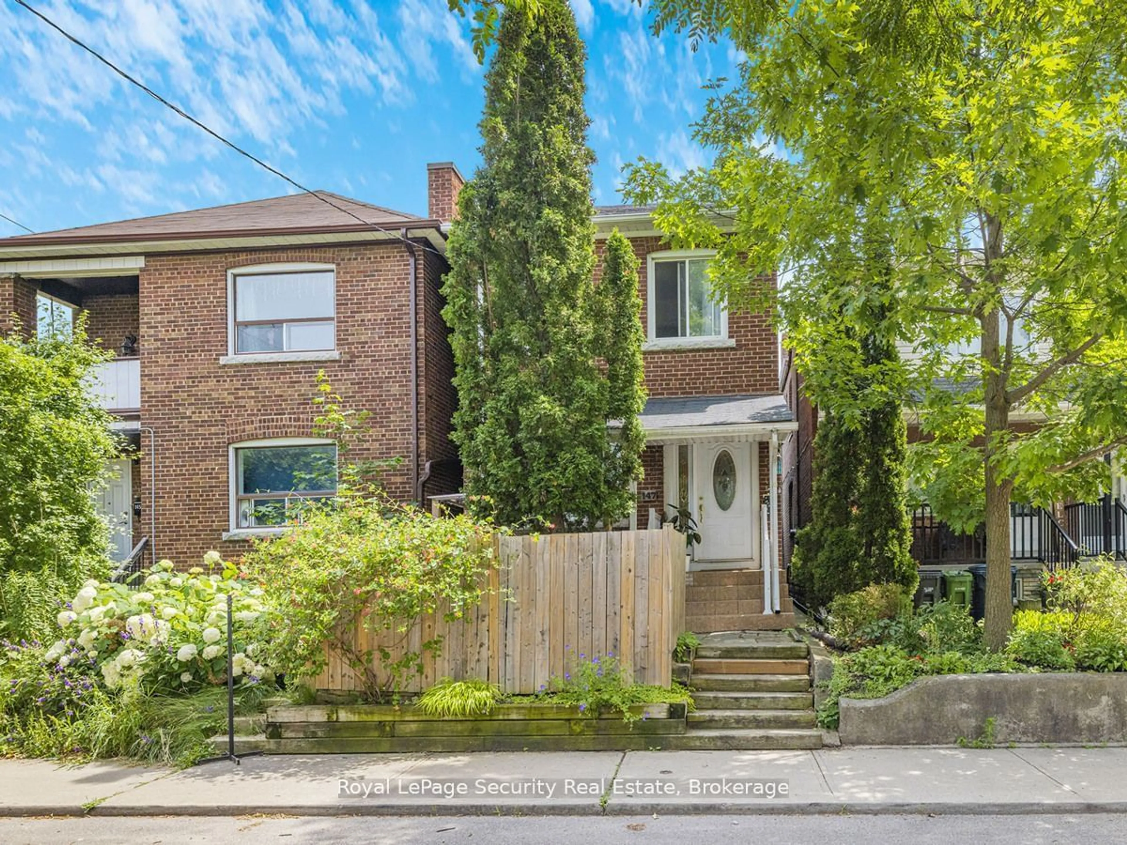 Frontside or backside of a home, the street view for 147 Hope St, Toronto Ontario M6E 1K4