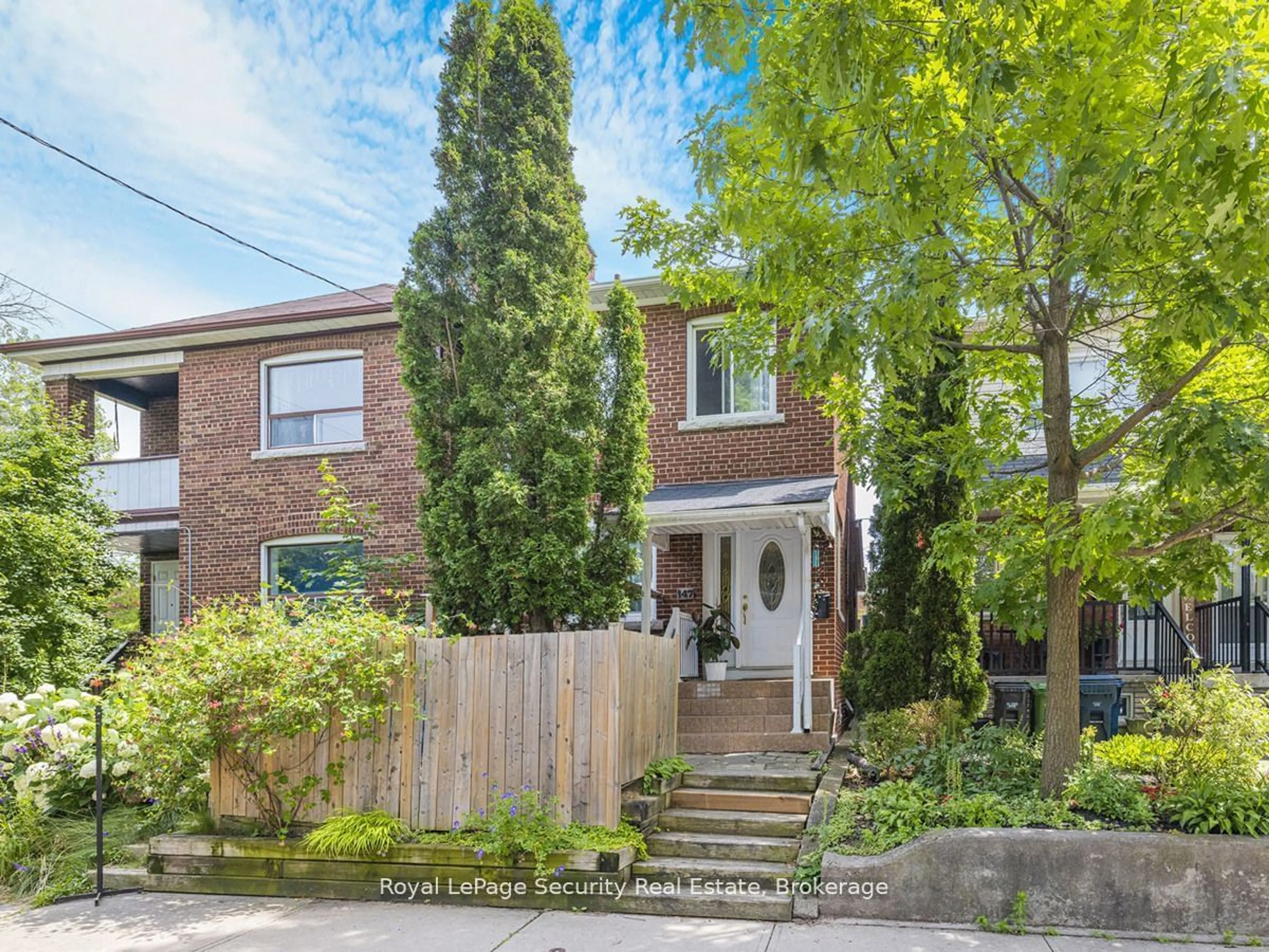 Frontside or backside of a home, the street view for 147 Hope St, Toronto Ontario M6E 1K4