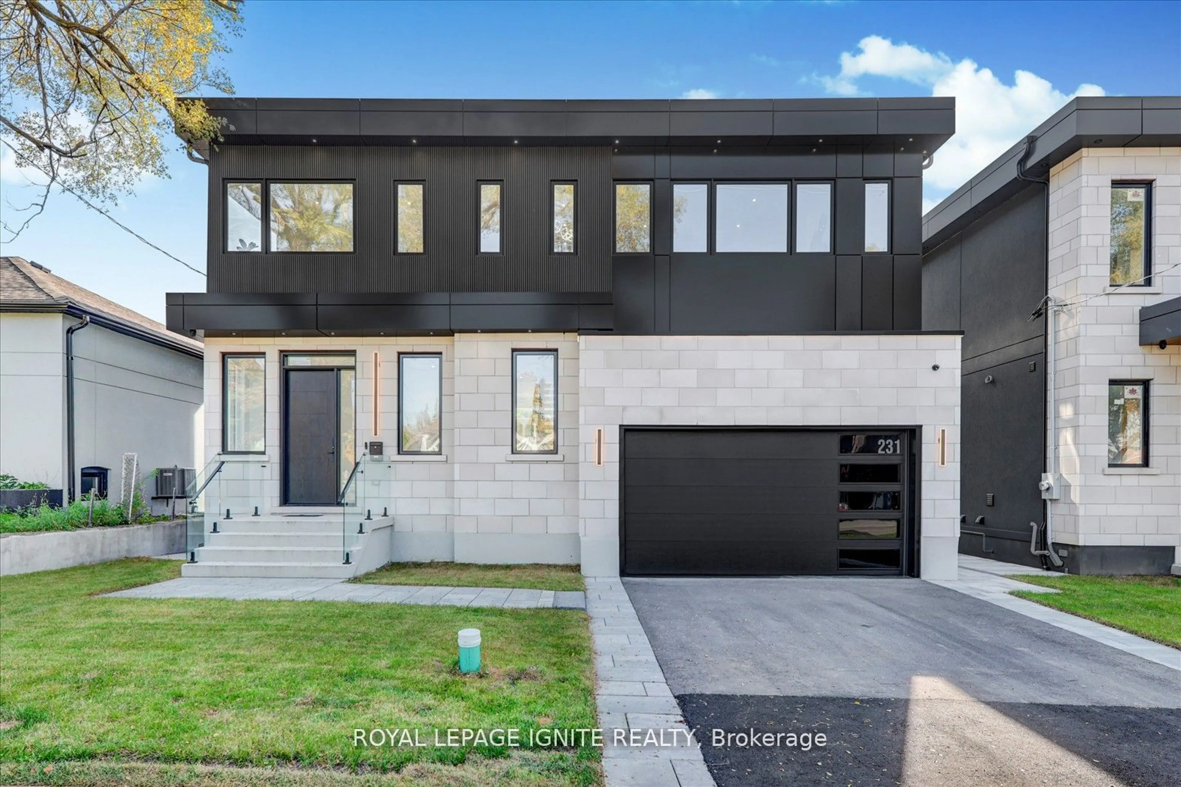 Frontside or backside of a home, the street view for 231 Falstaff Ave, Toronto Ontario M6L 2G2