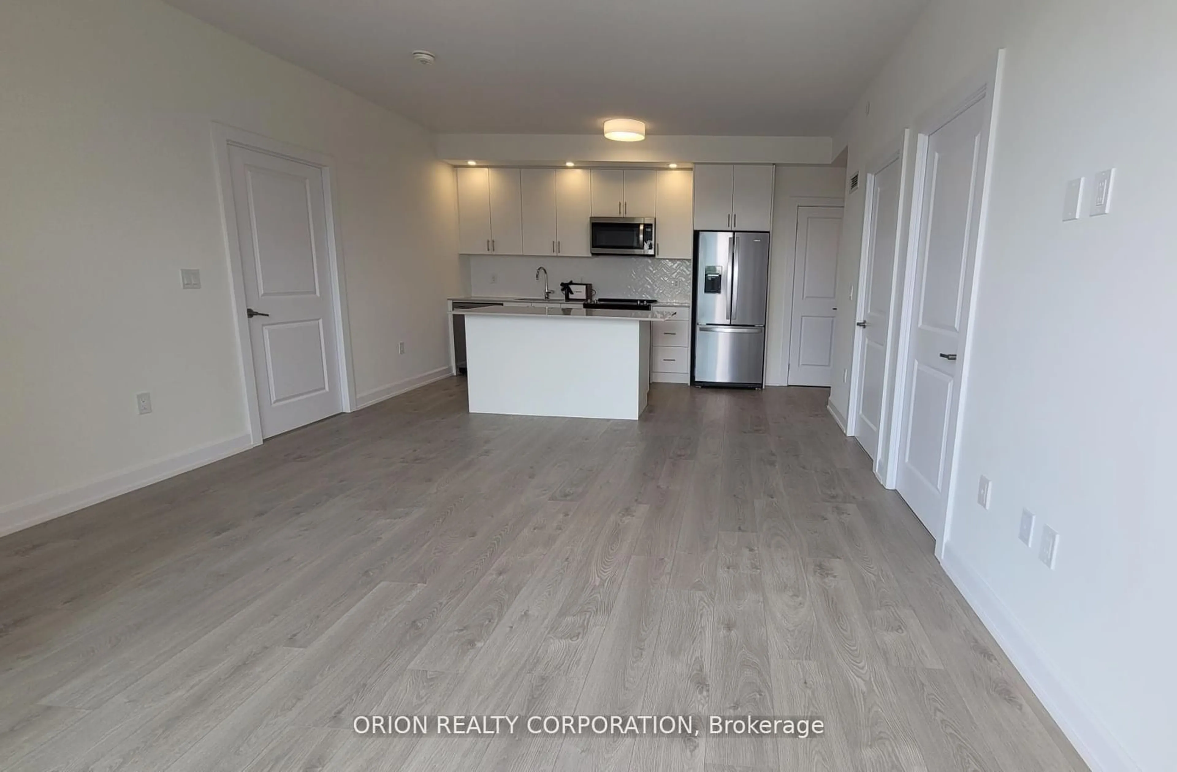 A pic of a room, wood floors for 3200 William Coltson Ave #508, Oakville Ontario L6H 7W6