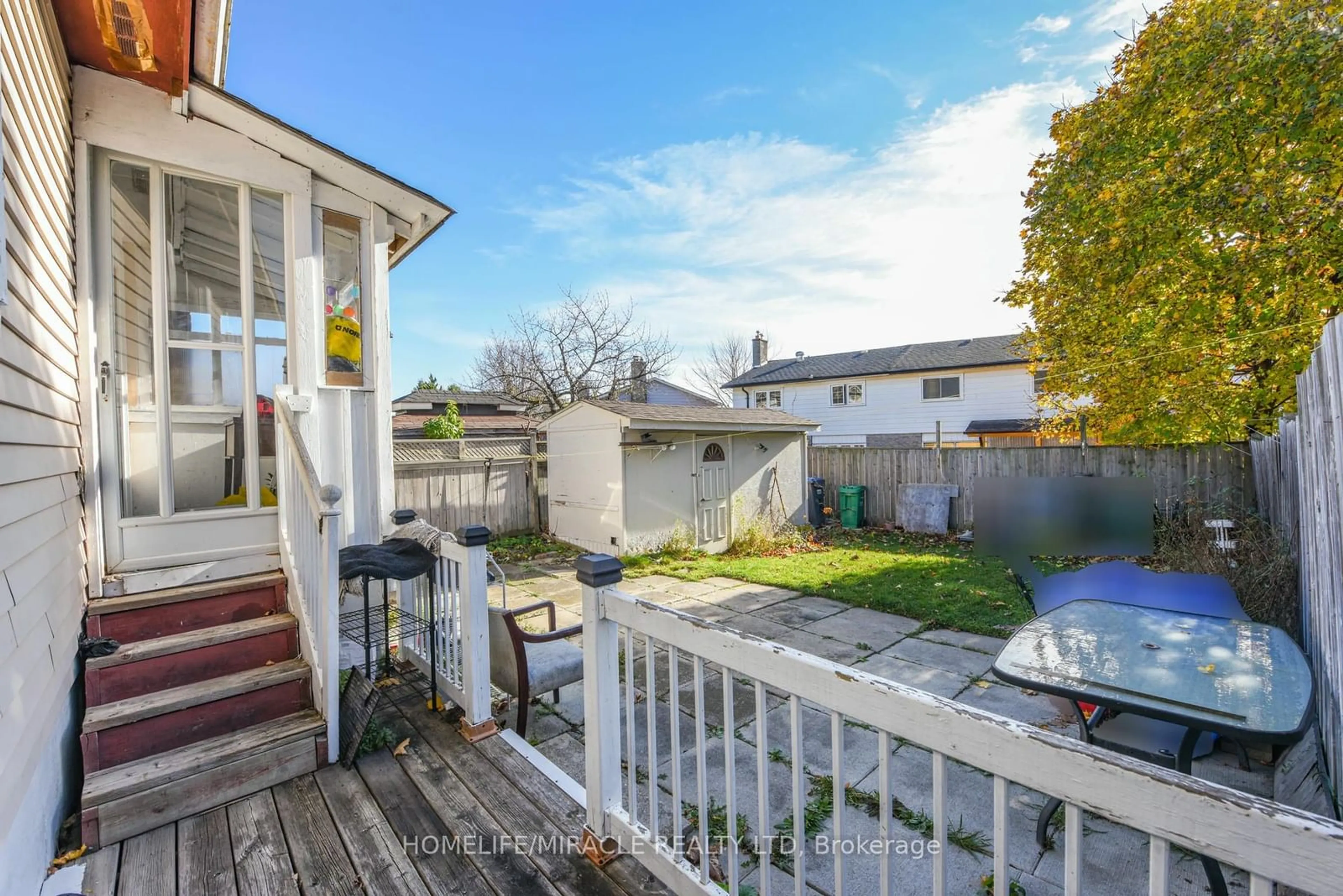 Frontside or backside of a home, the fenced backyard for 235 Hansen Rd, Brampton Ontario L6V 2T5